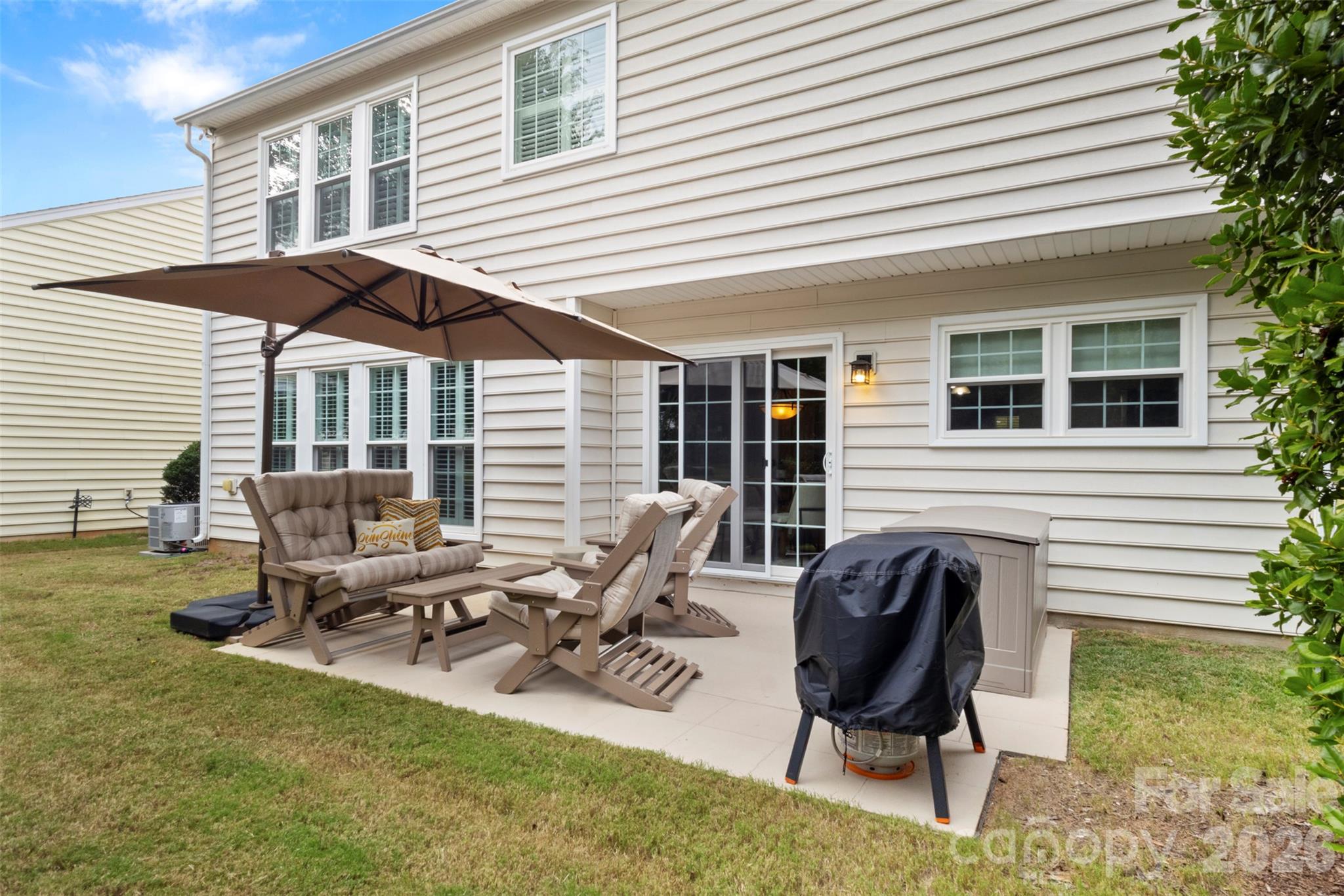 Back patio offers a comfortable area for furniture and grilling area - 18912 Harbor Cove Drive, Cornelius