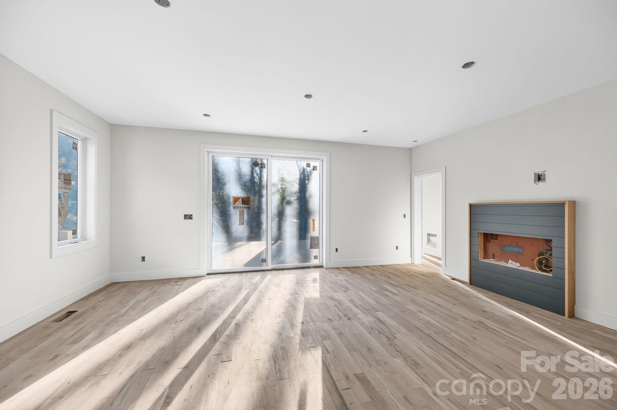 Spacious Living Room with Shiplap-Surround Electric Fireplace - 310 Pearson Drive, Asheville