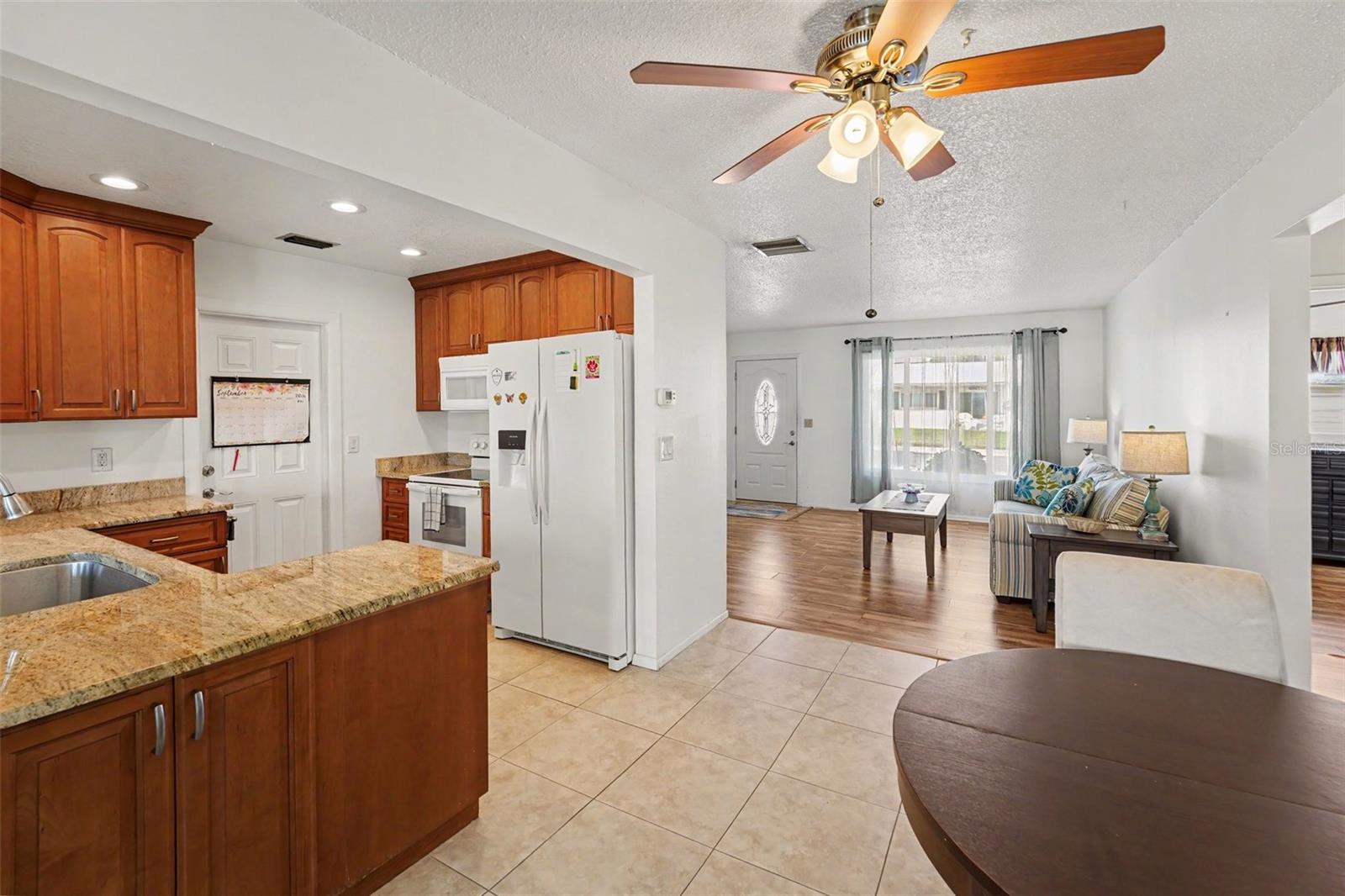 Kitchen and Dining Area with Tile Flooring - 3474 101ST TER N, PINELLAS PARK