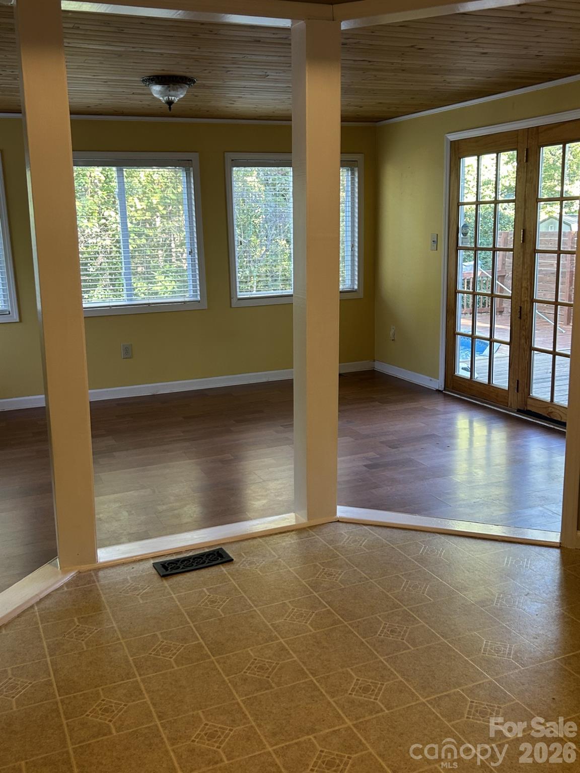 Kitchen area leading to sunroom - 1555 Brookbend Court, Fort Mill