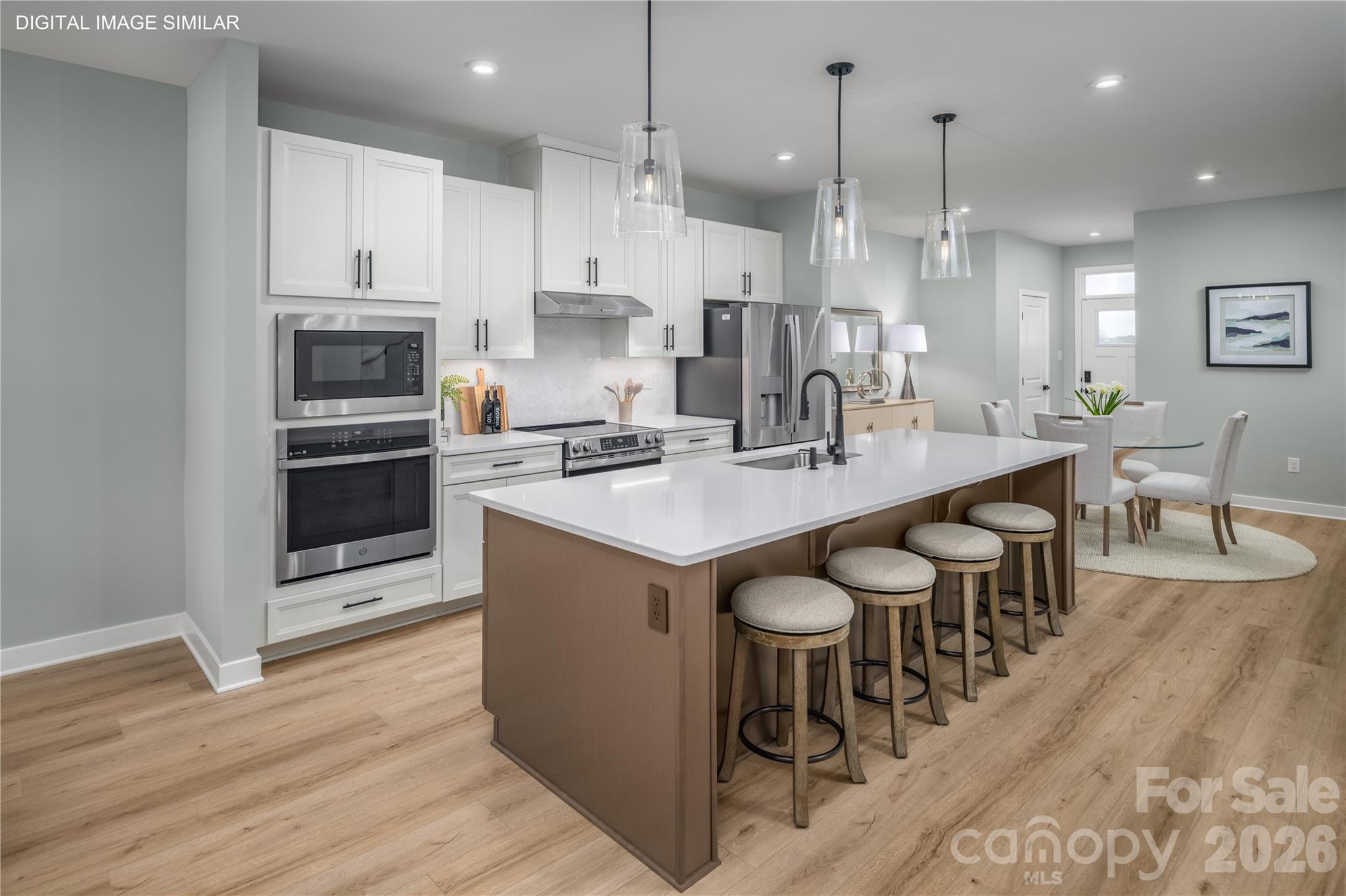 Bright, open kitchen with generous prep space and a large center island. - 11174 Emerson Landing Drive, Charlotte