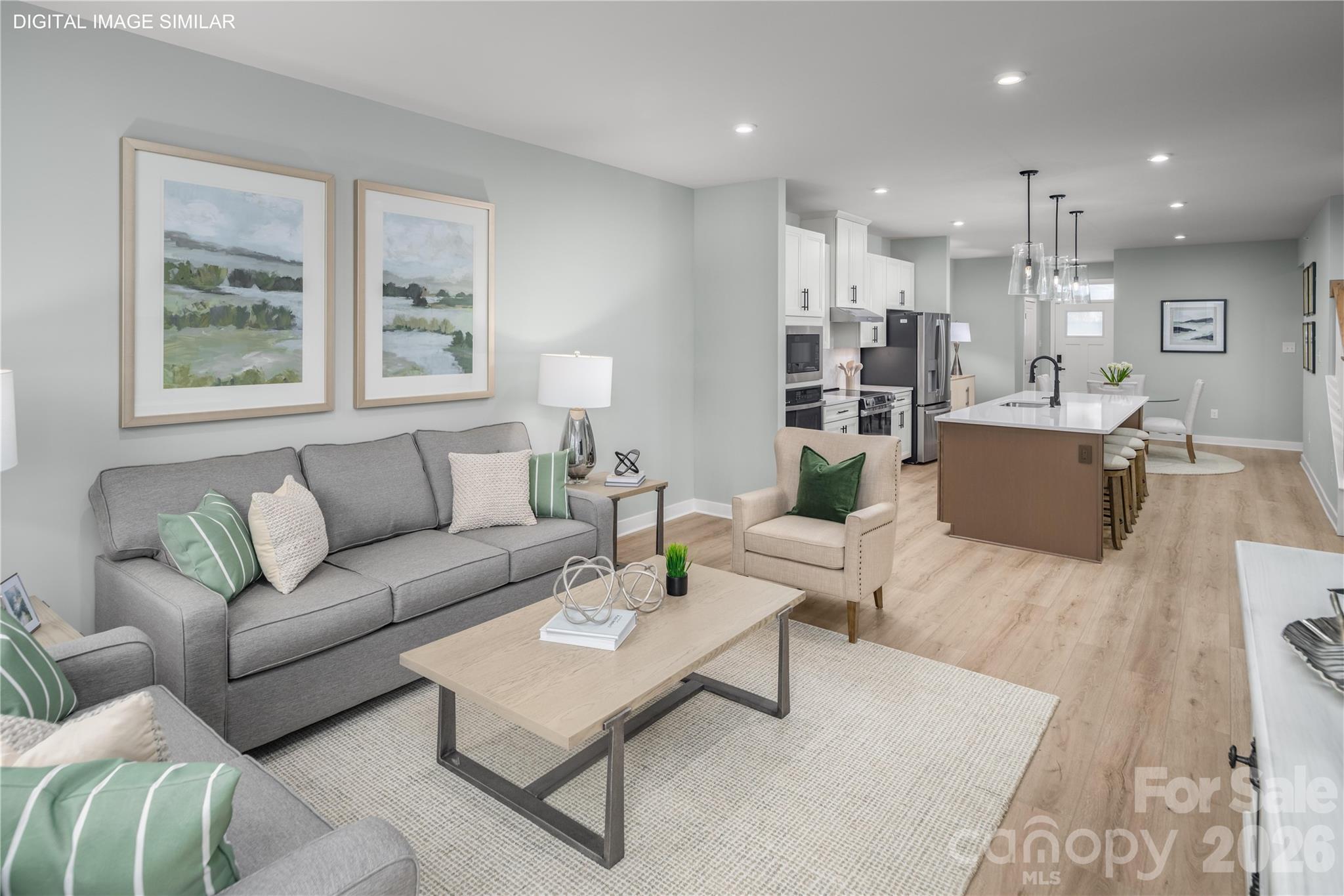 Living space that flows effortlessly into the kitchen—perfect for relaxing or gathering. - 11174 Emerson Landing Drive, Charlotte