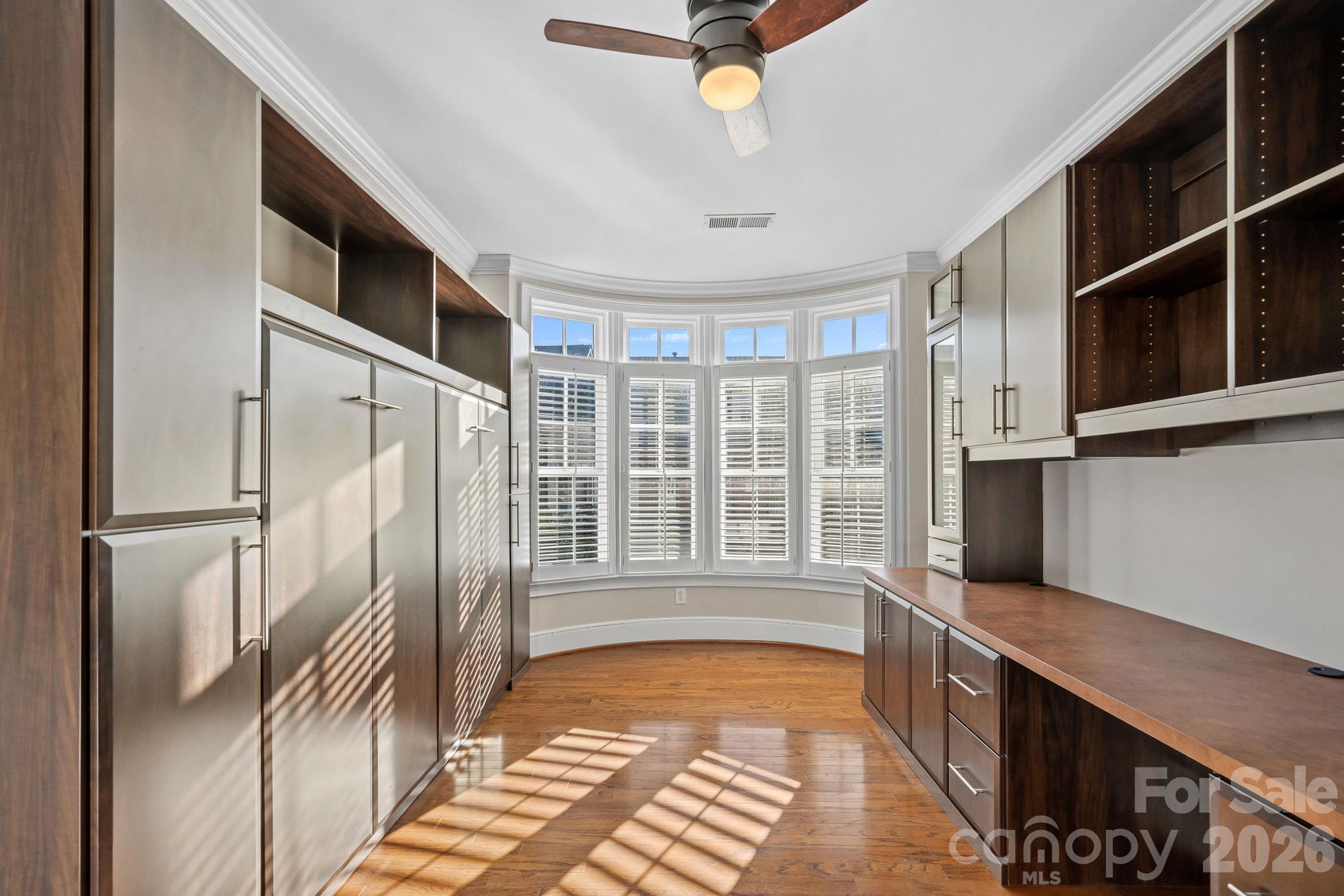 Bedroom 3 with office cabinetry and Murphy Bed - 6830 Louisburg Square Lane, Charlotte
