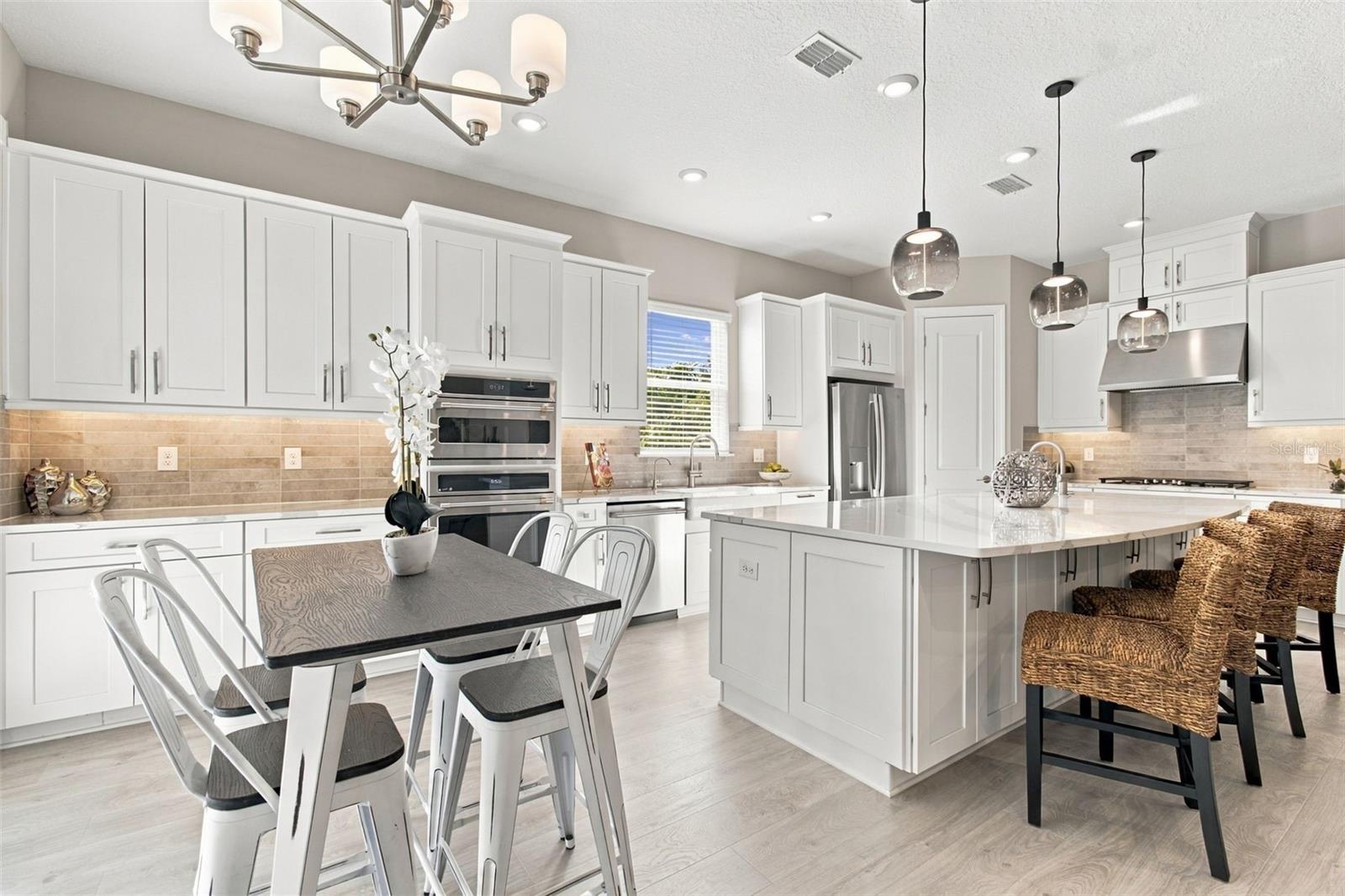 Upgraded kitchen with extended cabinetry provides great storage - 29749 CASSINO CT, WESLEY CHAPEL