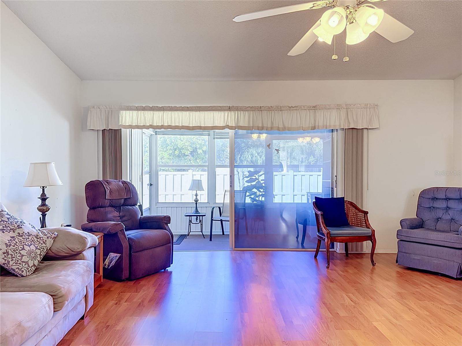 Living room with attached sunroom. - 3206 42ND ST W #NA, BRADENTON