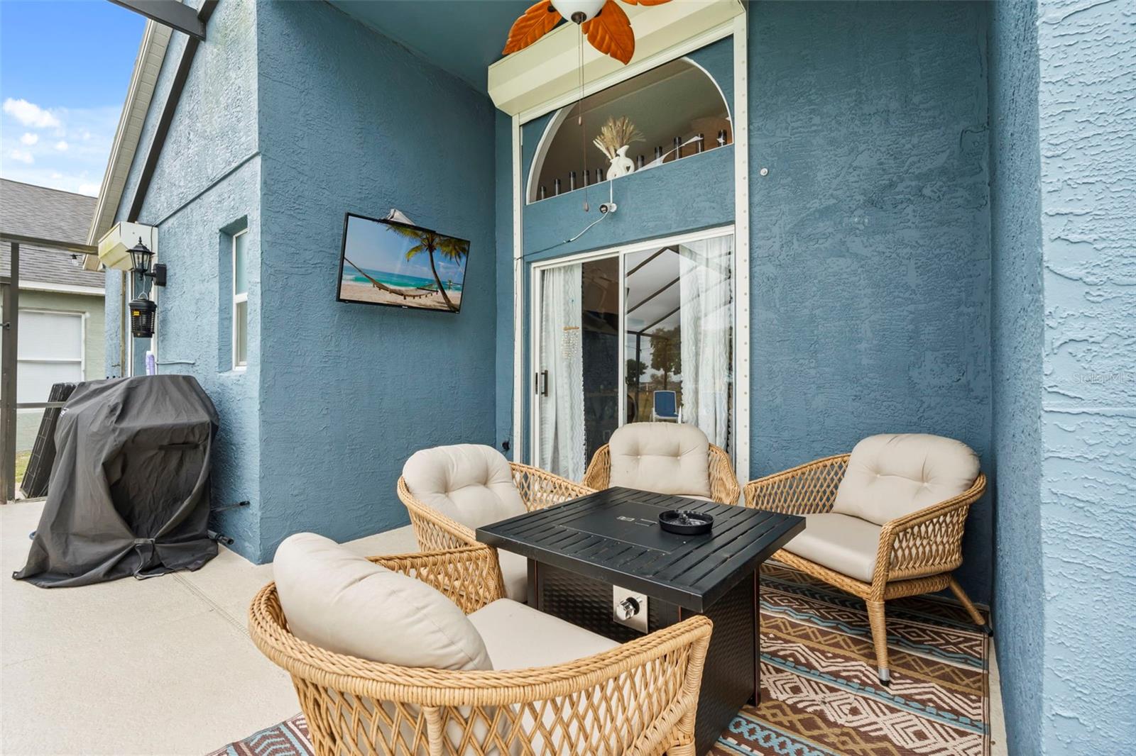 Covered back Lanai seating area - 551 MAJESTY DR, DAVENPORT