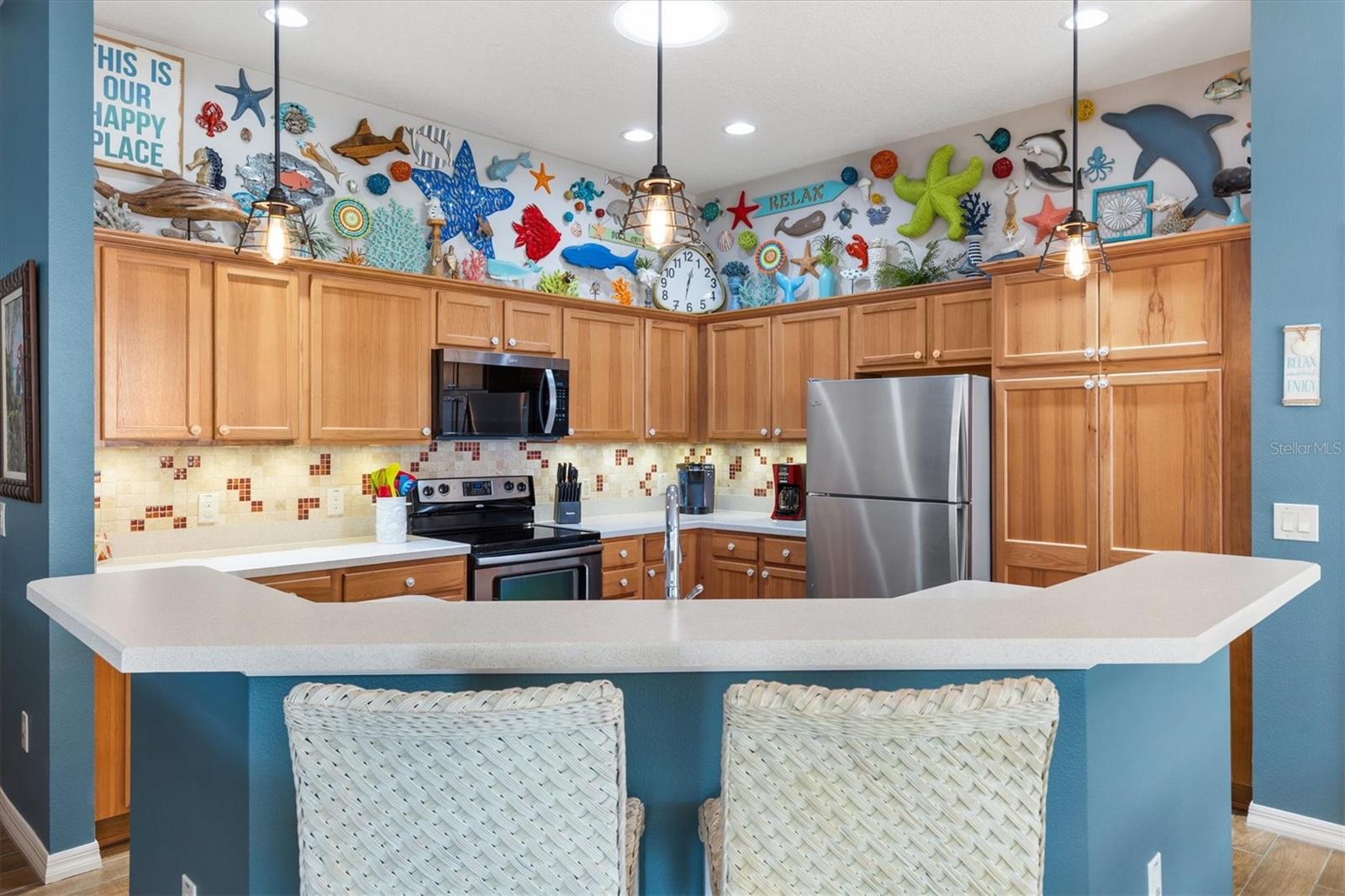 KITCHEN WITH BAR STOOLS - 2398 FLATWOOD ST, THE VILLAGES