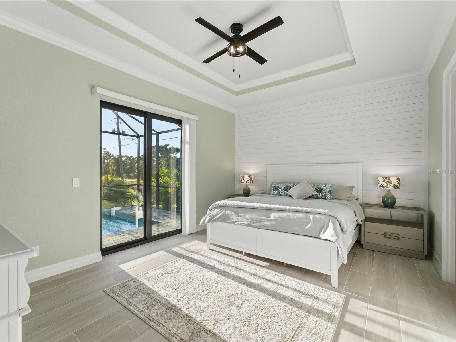 Primary Bedroom with access and view of the pool - 149 LONG MEADOW LN, ROTONDA WEST