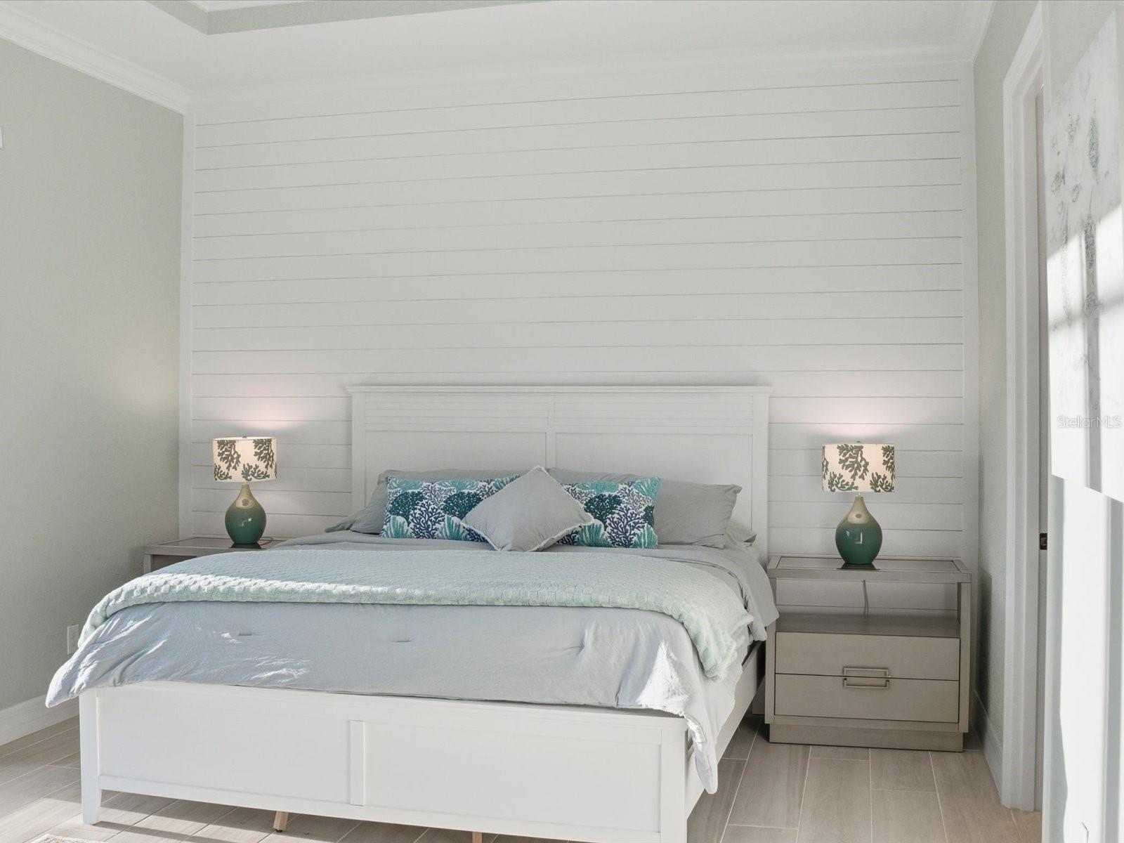 Shiplap accented wall along with crown molding around room and tray ceiling - 149 LONG MEADOW LN, ROTONDA WEST