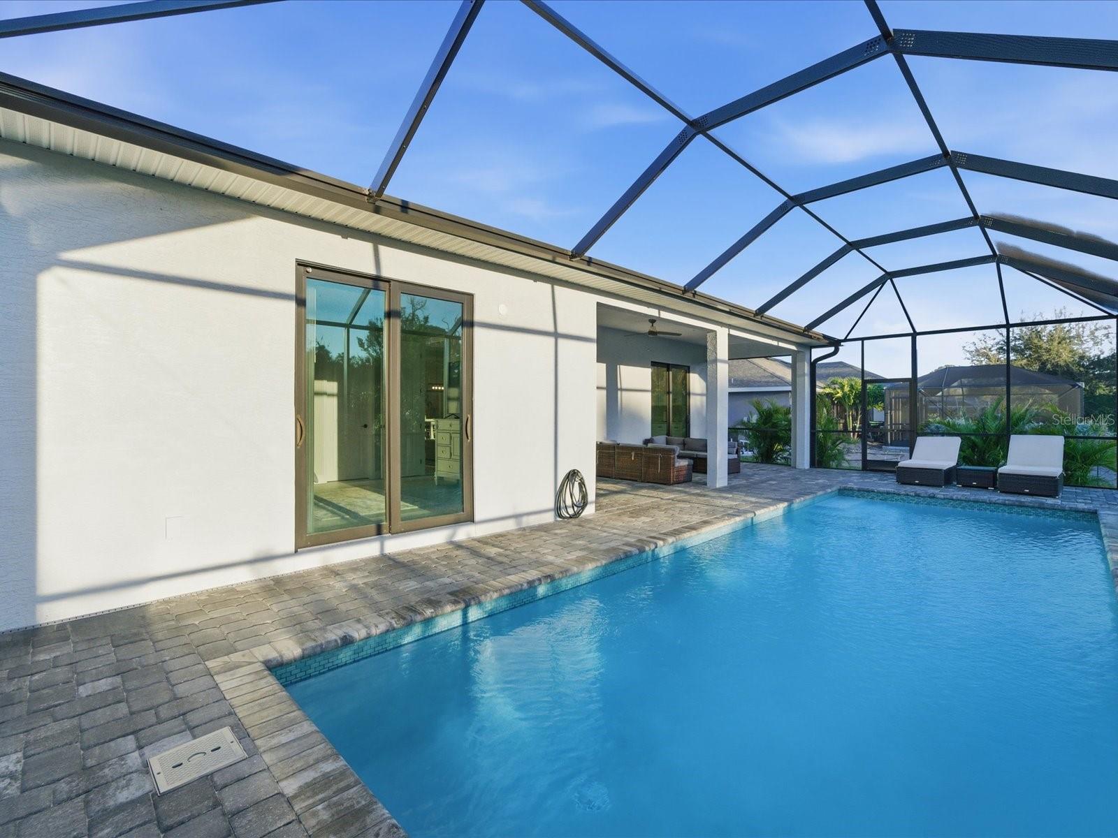 Pool area with Primary Suite's private entrance - 149 LONG MEADOW LN, ROTONDA WEST