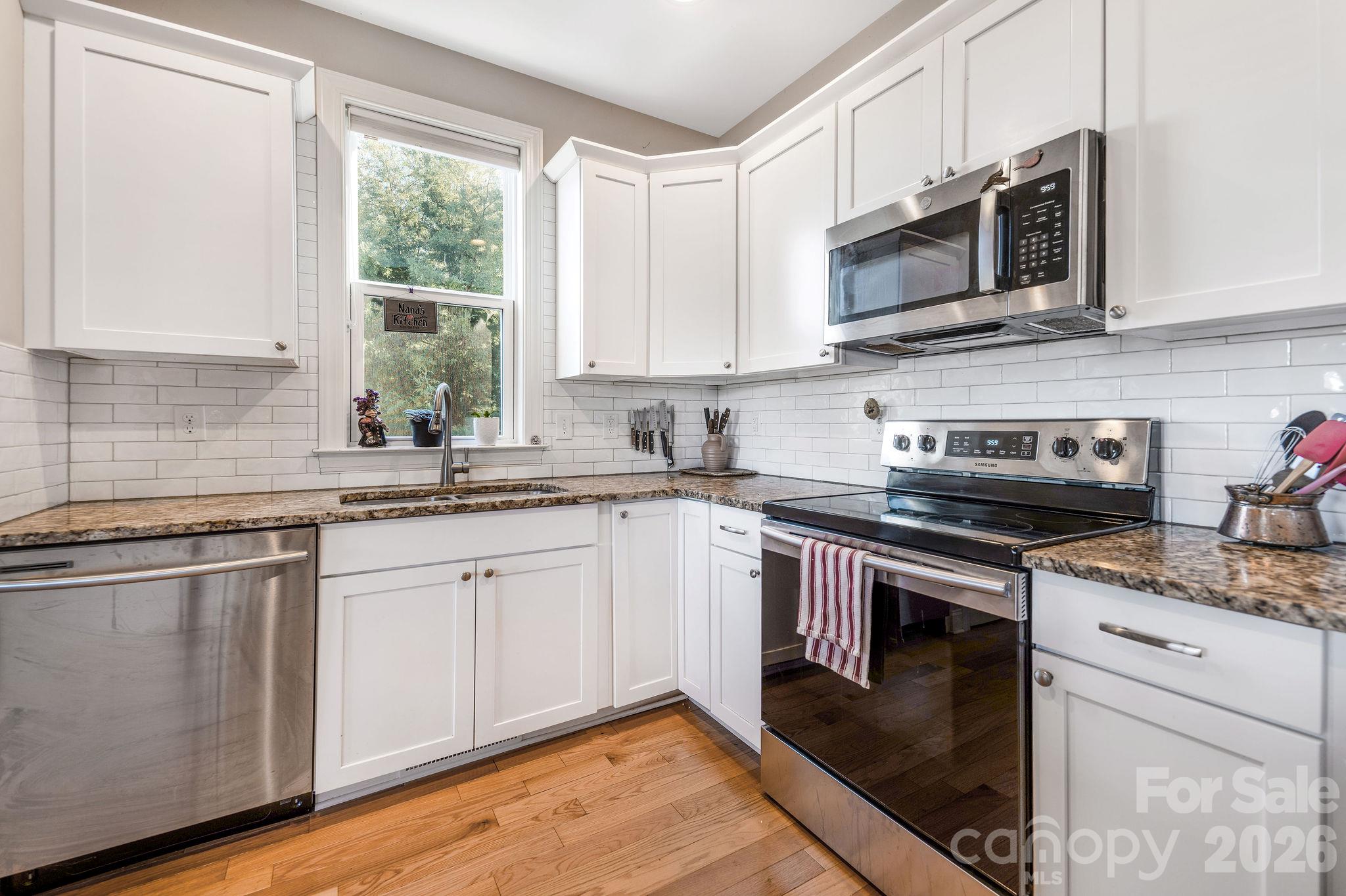 clean, bright kitchen with stainless steel appliances - 50 Rose Creek Road, Leicester