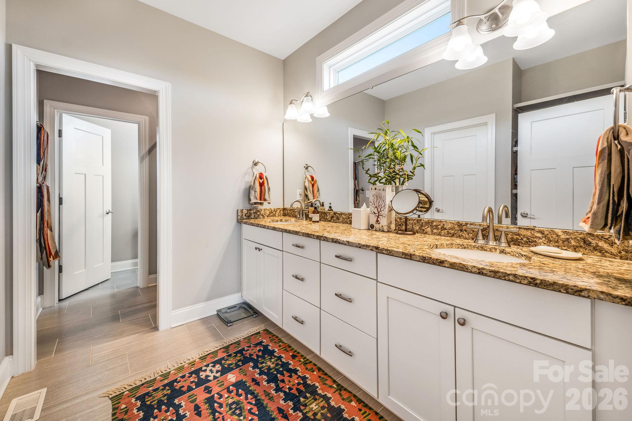 double vanities with lots of storage in the primary bath - 50 Rose Creek Road, Leicester