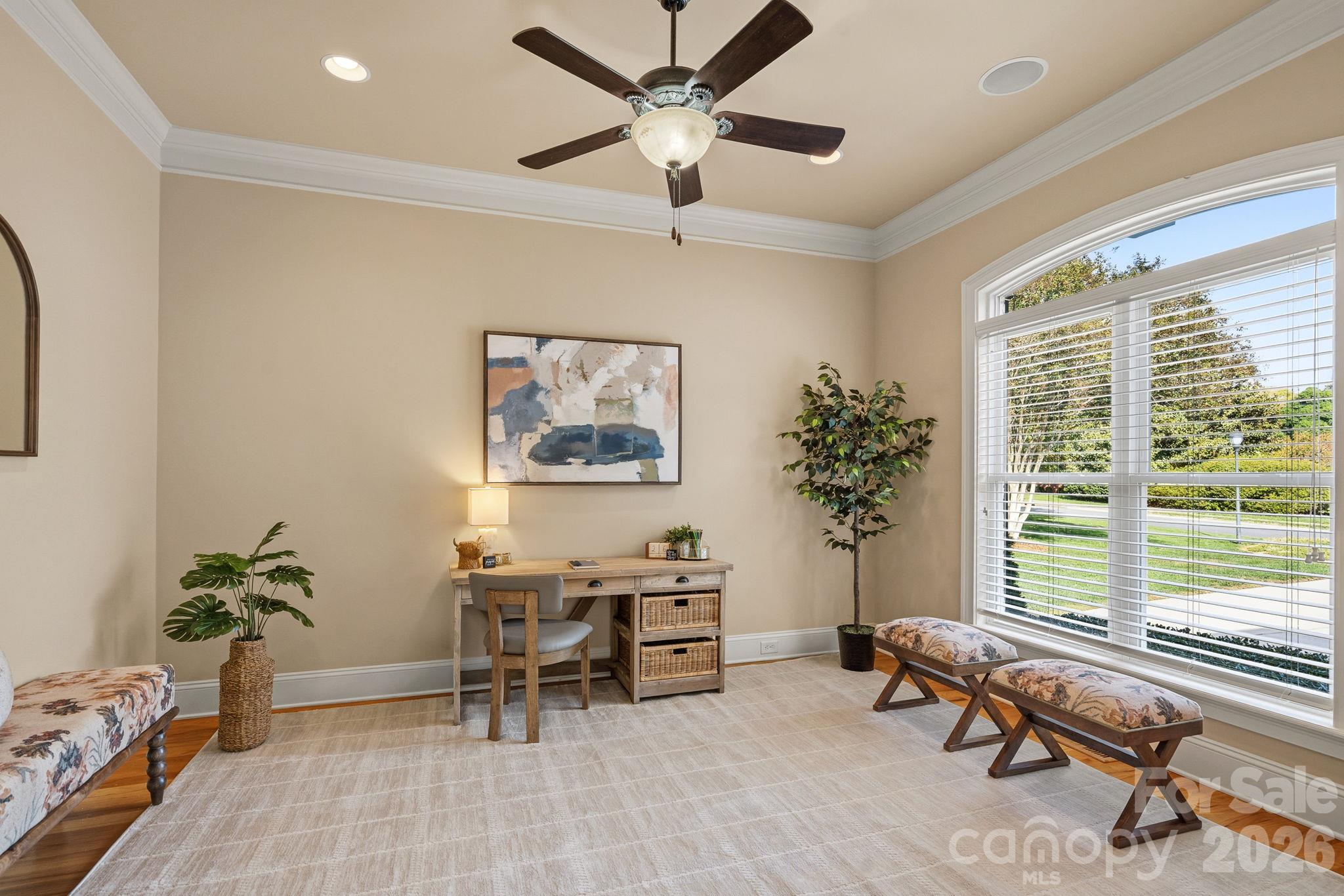 Dedicated home office looks out over the front yard, offering a quiet, productive workspace - 108 Lazenby Drive, Fort Mill