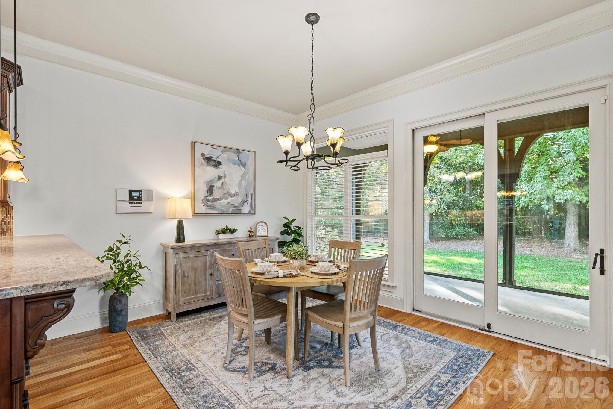 Adjacent to the kitchen, a bright eat-in dining area transitions naturally to the outdoors. - 108 Lazenby Drive, Fort Mill