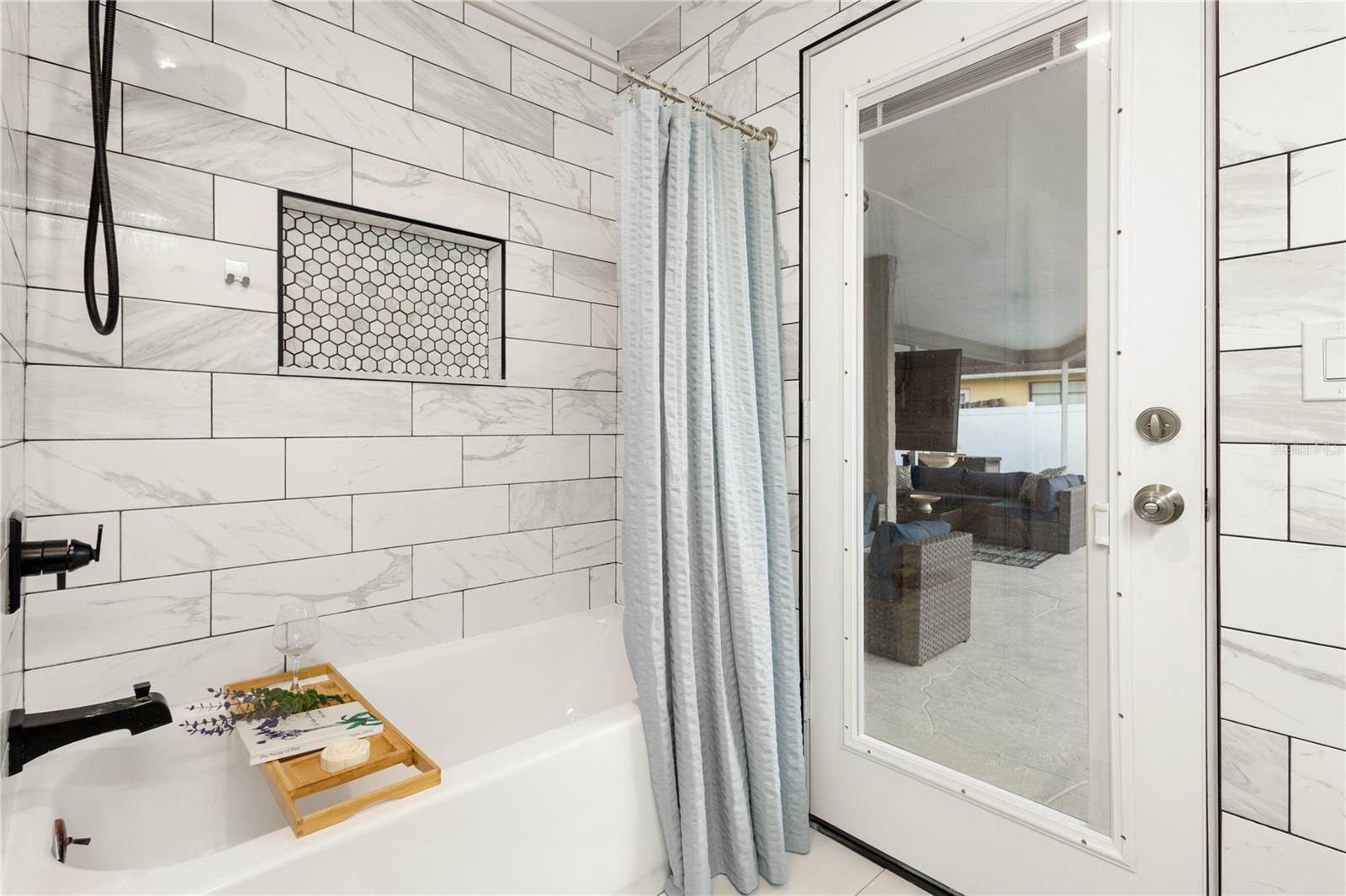 GUEST BATH WITH POOL ACCESS - 3222 WESSEX WAY, CLEARWATER