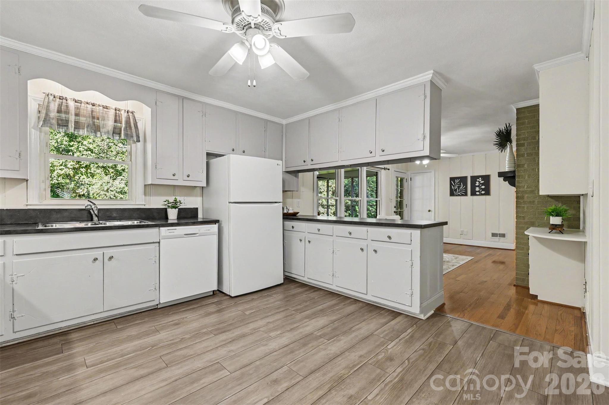 A cheerful kitchen with abundant cabinetry, generous counter space, and room to move. - 407 Pine Street, Fort Mill