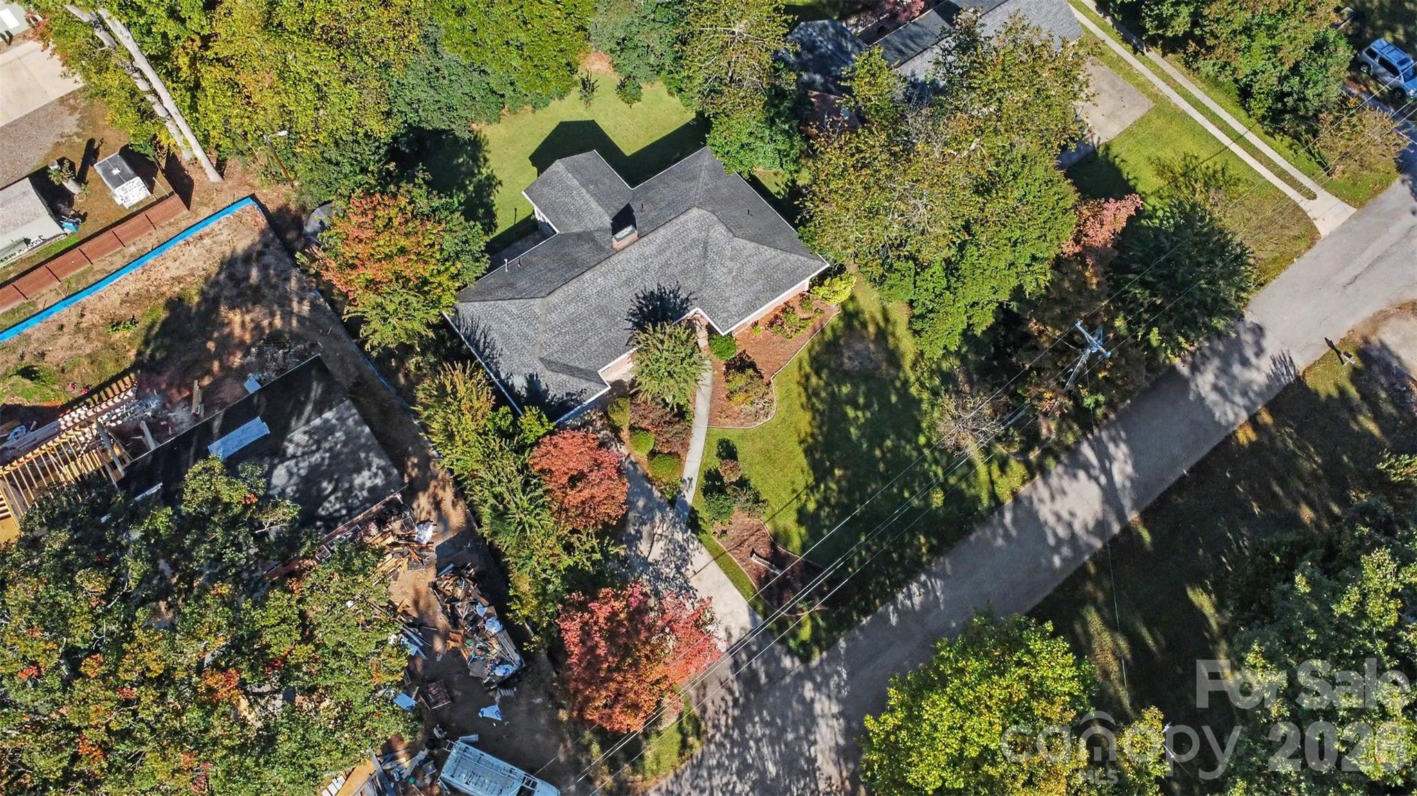 An overhead view showcases the home's footprint, driveway, and surrounding greenery. - 407 Pine Street, Fort Mill