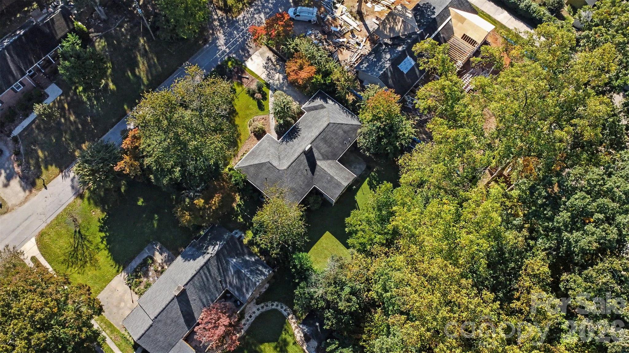 Another perspective of the property's generous lot and surrounding mature trees. - 407 Pine Street, Fort Mill