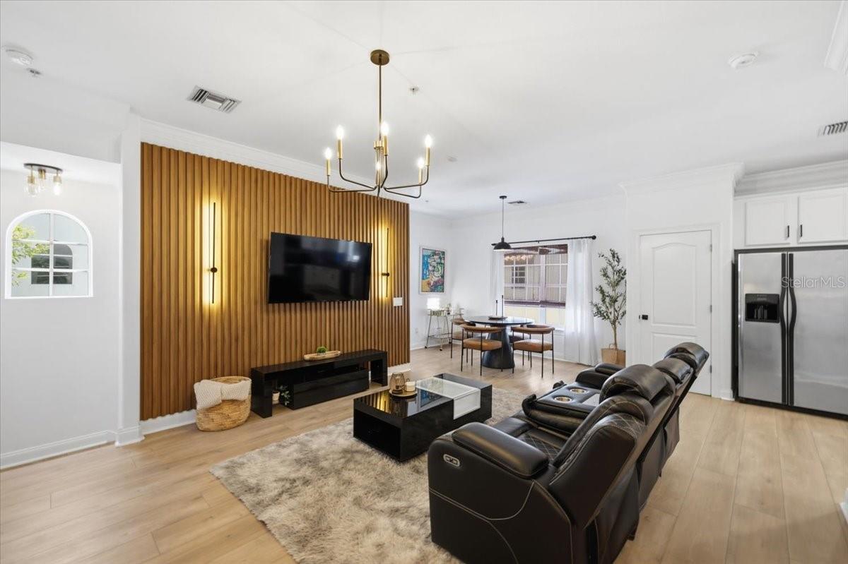 Fluted Ribbon Maple Accent Wall with Sconce LED Lighting and LVP Flooring throughout! - 2315 W NORTH A ST #3, TAMPA
