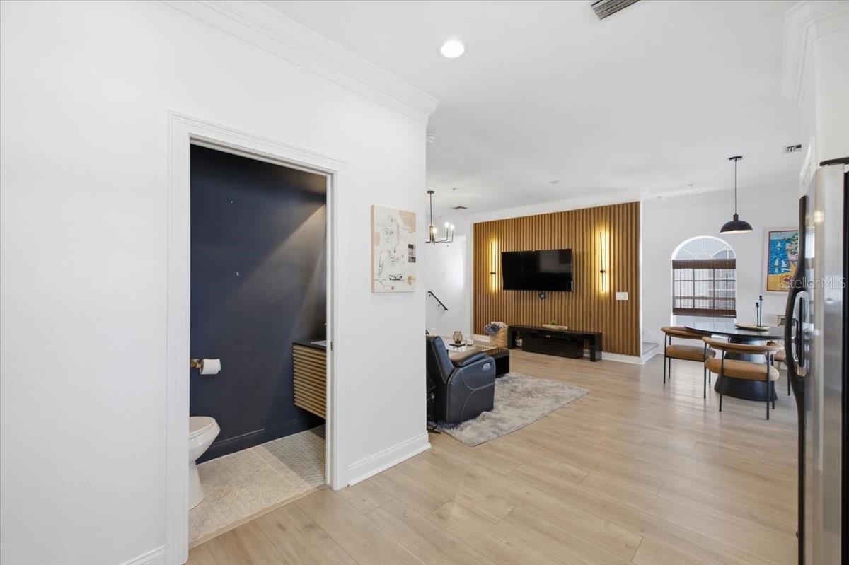 View from Kitchen into Living Room, half bath on main living floor. - 2315 W NORTH A ST #3, TAMPA