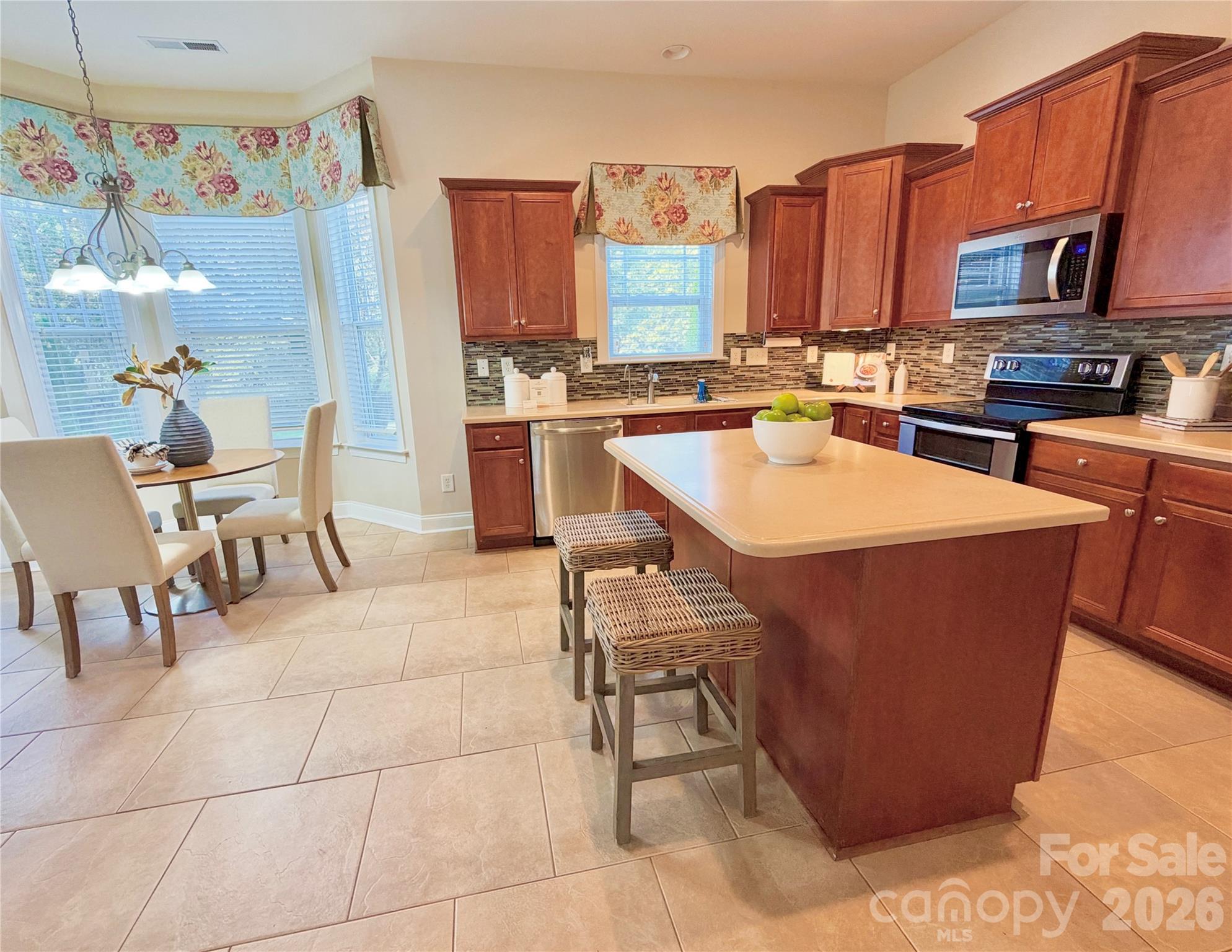The Kitchen boasts tons of cabinets, and an island - 1507 Belmont Stakes Avenue, Indian Trail