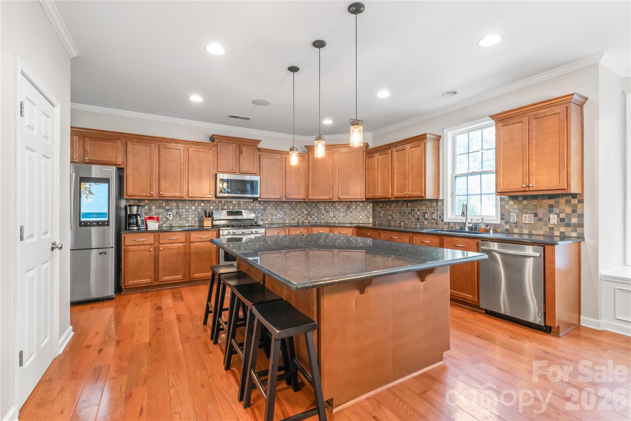 Chef's kitchen with an enormous island destined for entertaining - 6482 Chadwell Court, Indian Land