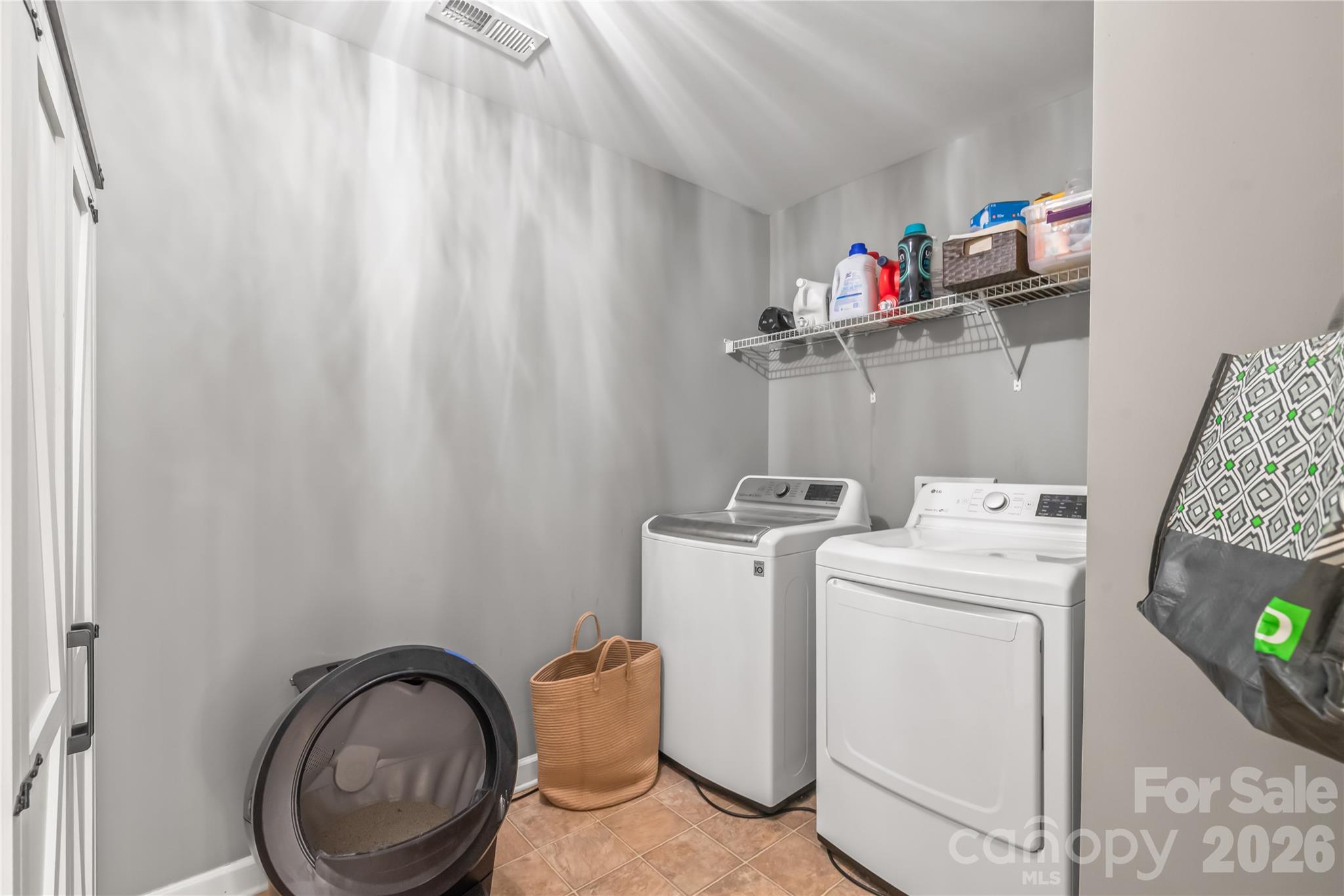 Upstairs laundry room with plenty of room for storage - 6482 Chadwell Court, Indian Land