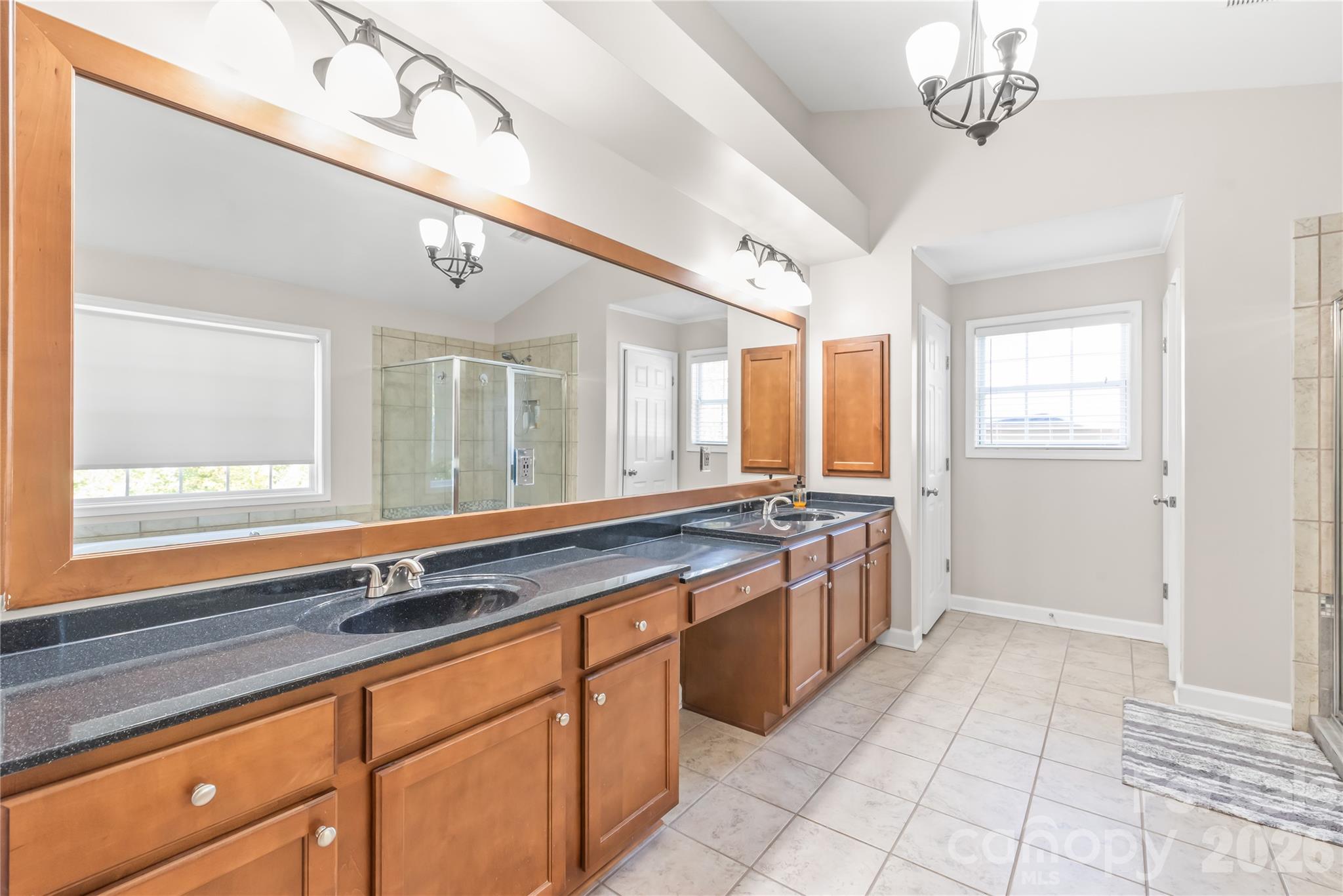 Primary bathroom with double sinks, two walk-in closets and a separate water closet - 6482 Chadwell Court, Indian Land