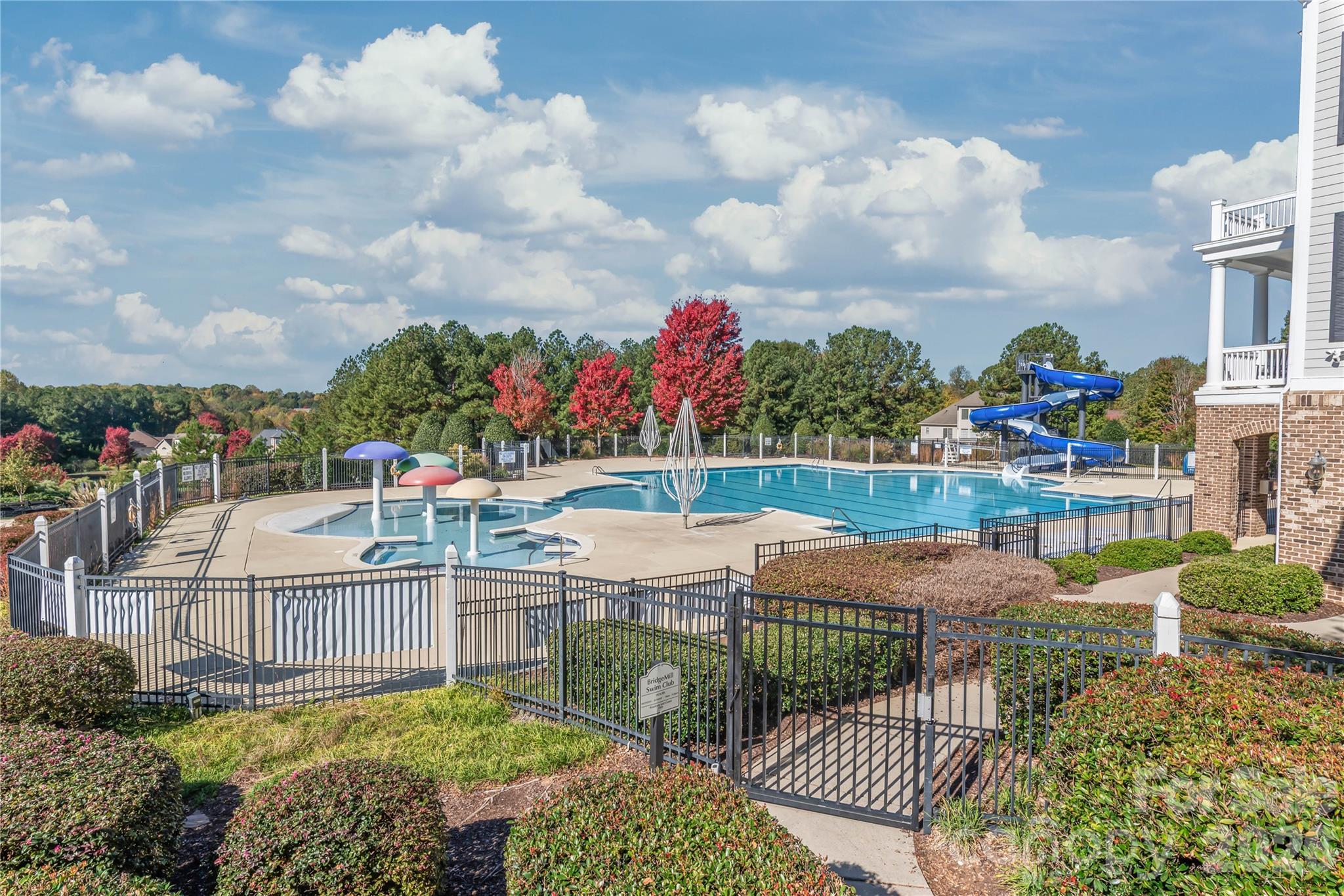 Large pool with zero entry area, and a twisty slide, home to the Bridgemill Bluefins swim team - 6482 Chadwell Court, Indian Land