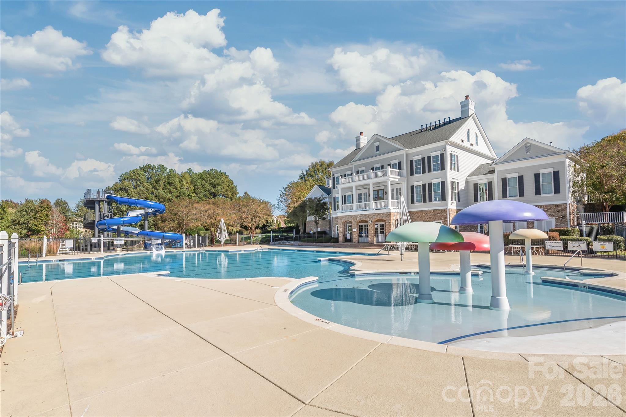 A view of the pool and the rear of the clubhouse - 6482 Chadwell Court, Indian Land