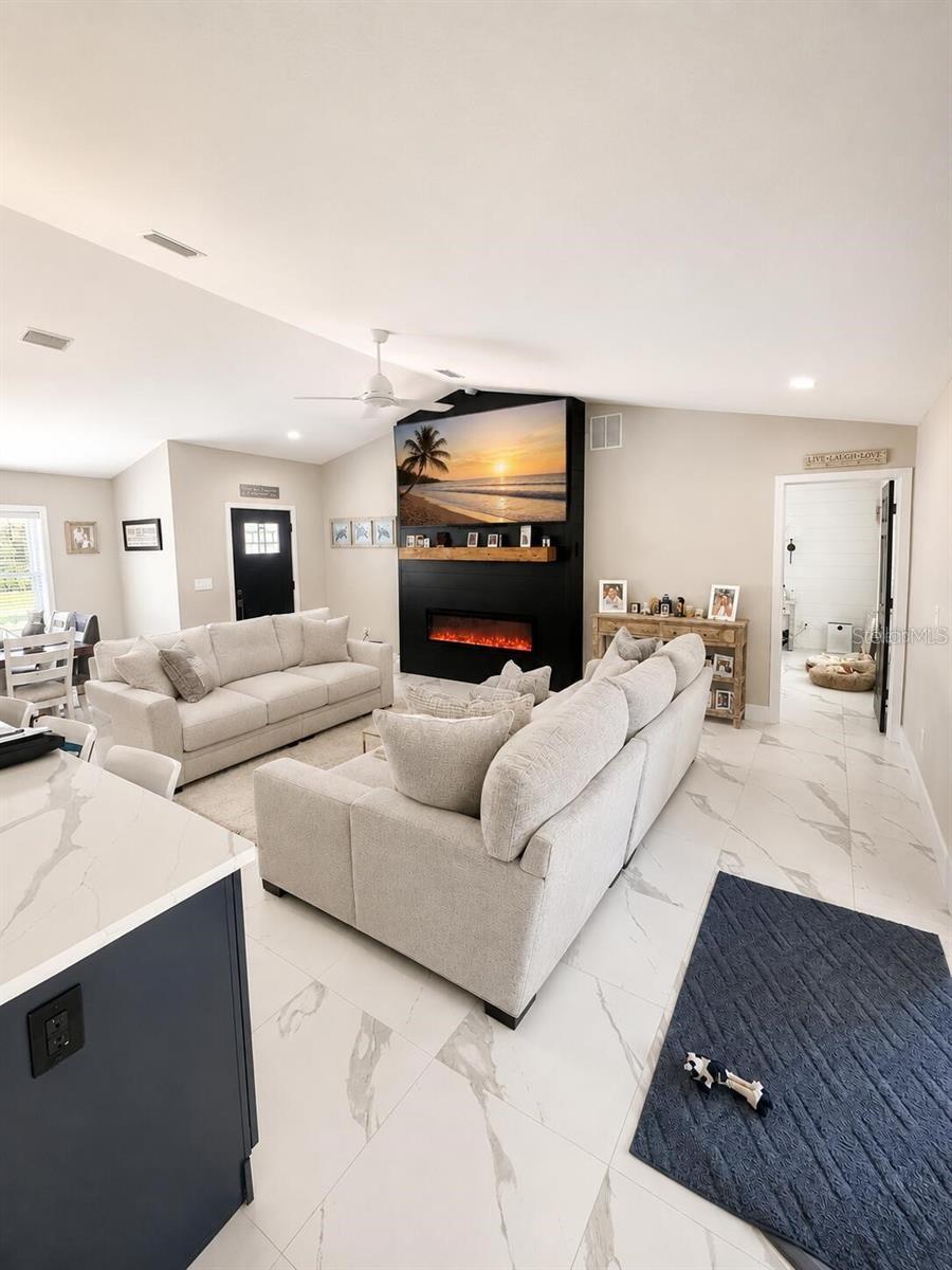 living room kitchen open floor plan - 14 LAMOYNE LN, PALM COAST
