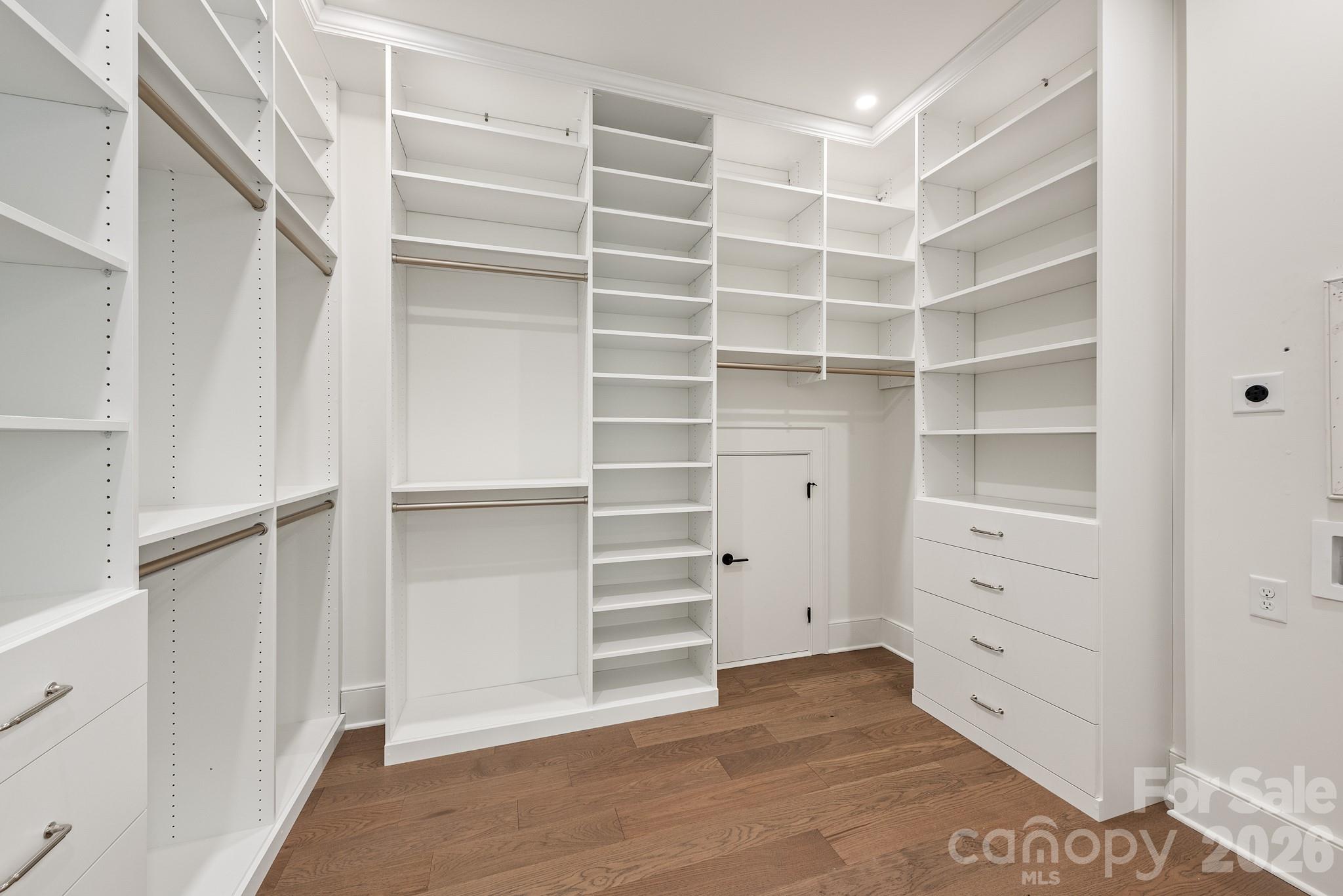 Primary Walk-In Closet with Built-In Shelving - 4609 Rockford Court, Charlotte