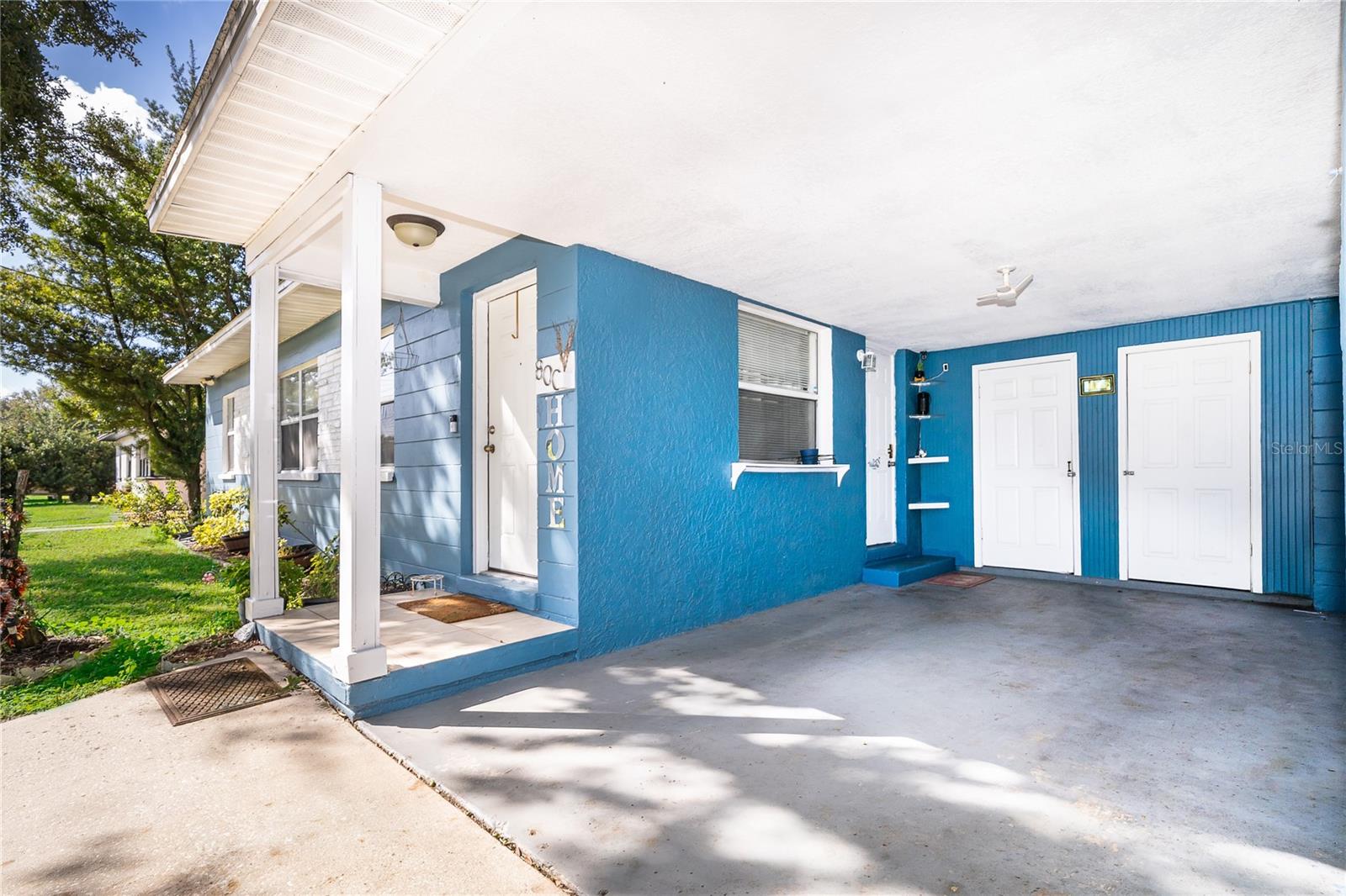 Enjoy the convenience of an attached garage, a spacious driveway, and a welcoming front entrance. - 800 DORADO AVE, ORLANDO
