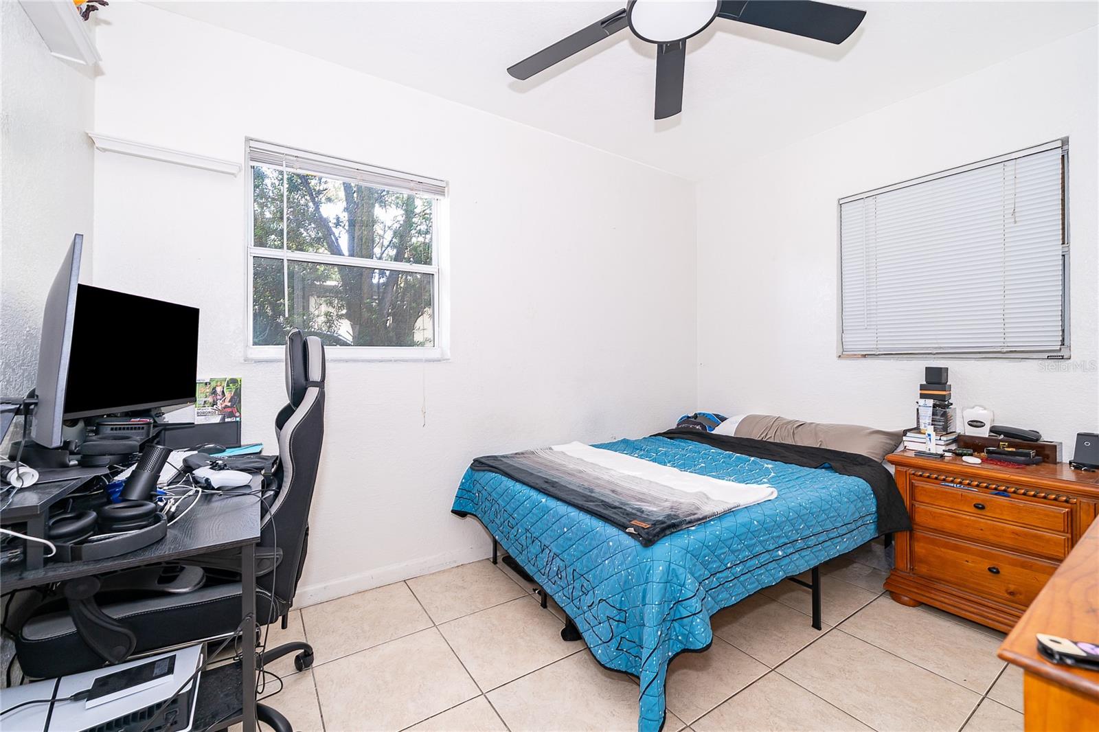 This versatile bedroom offers flexibility for guests, a home office, or additional living space to suit your needs. - 800 DORADO AVE, ORLANDO