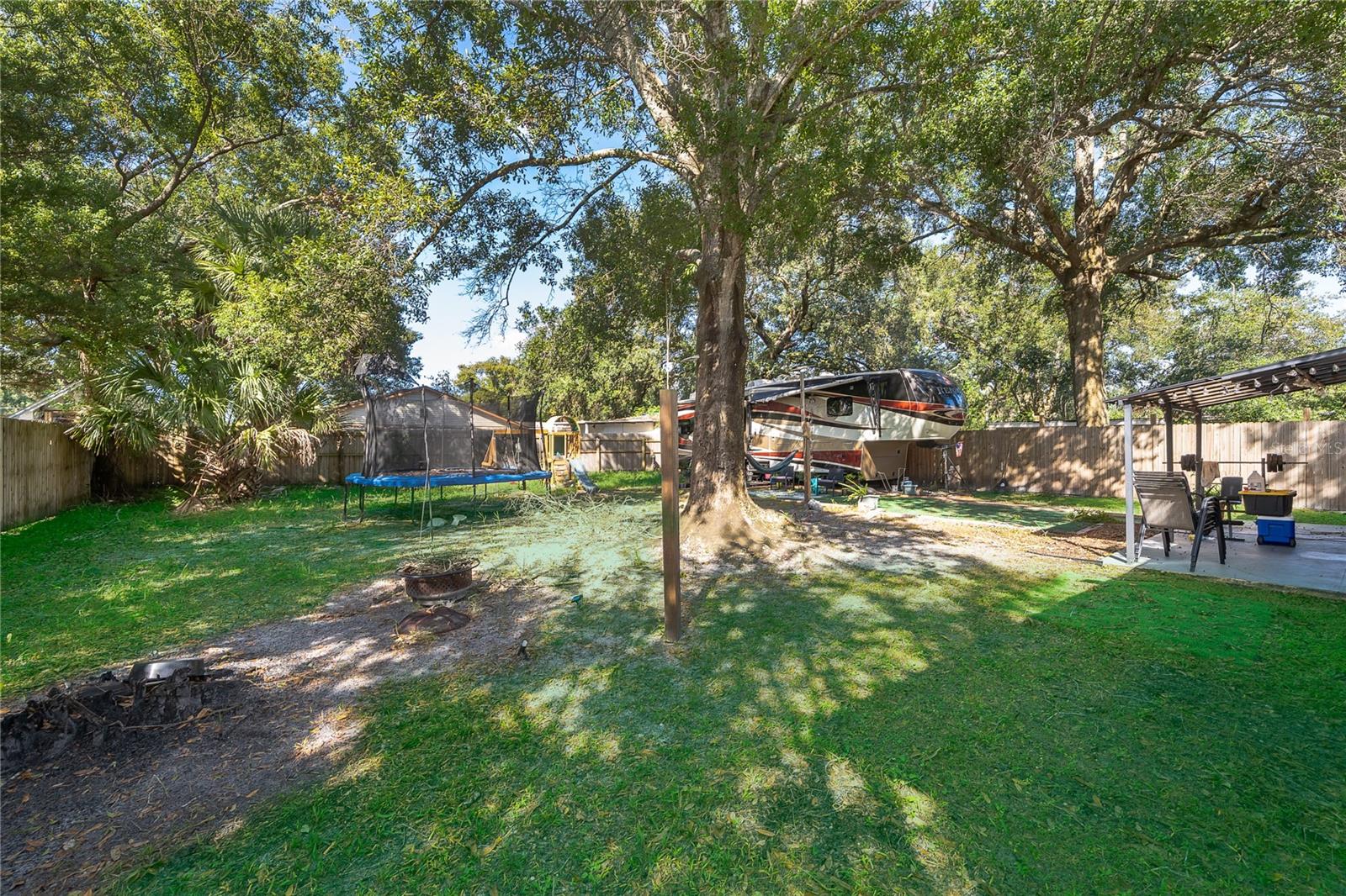 Imagine weekend gatherings, outdoor activities, or simply relaxing beneath the shade of the beautiful mature trees. - 800 DORADO AVE, ORLANDO