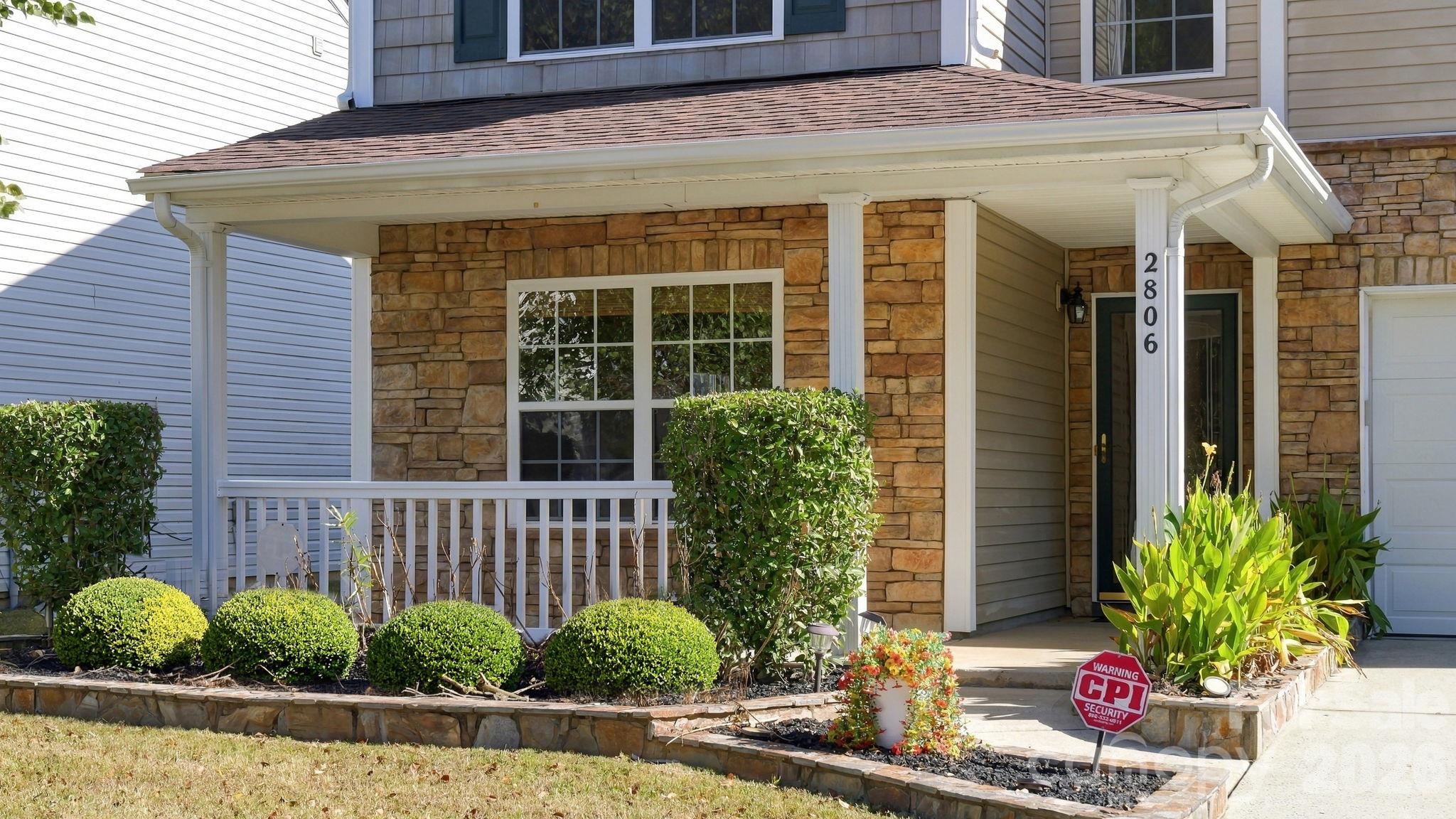 Front elevation showing 4 small AI generated bushes - 2806 Buckleigh Drive, Charlotte