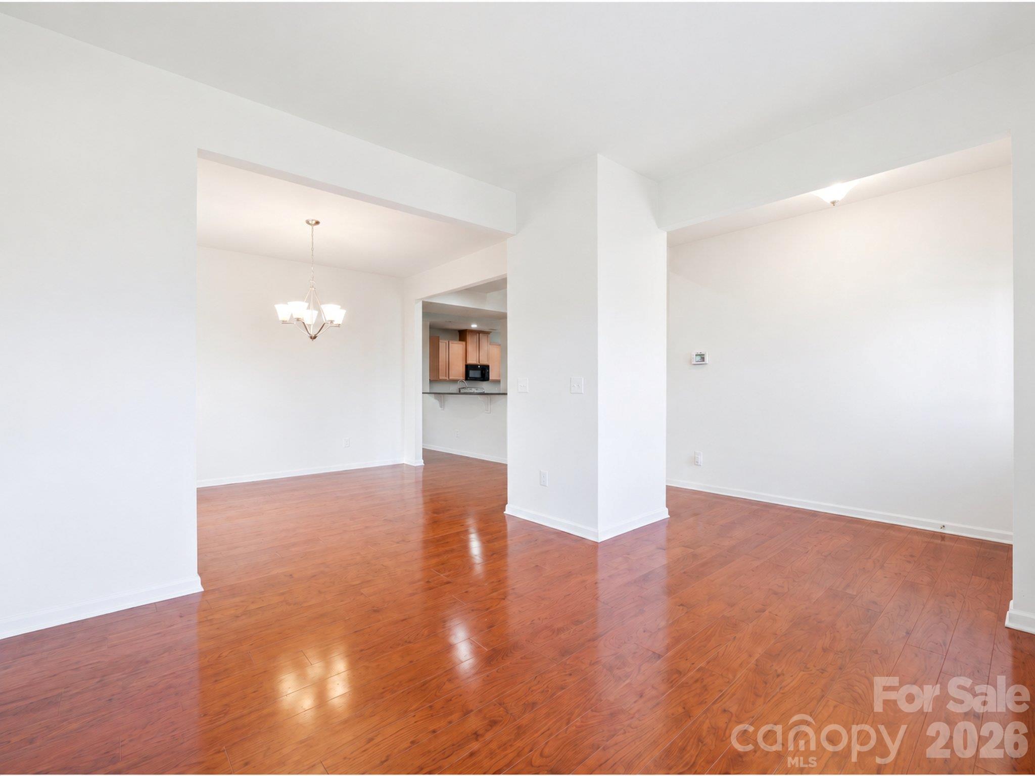 Main-level office/flex space: Adjoins the dining room and offers options for a home office, reading area, or hobby space. Personal property digitally removed. - 3341 Linetender Drive, Davidson