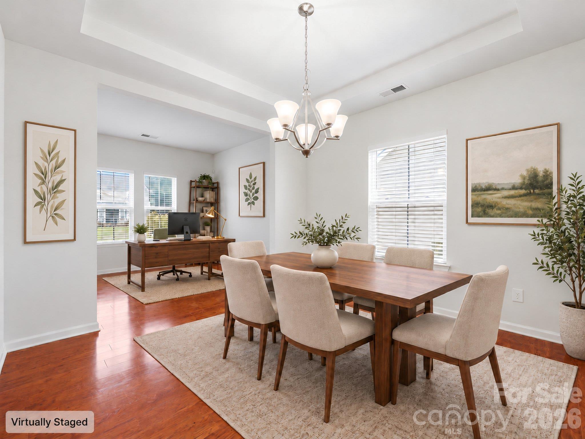 Virtually staged dining room illustrates space for gathering around the table, with an adjoining main-level office area. Furnishings and décor digitally added. - 3341 Linetender Drive, Davidson