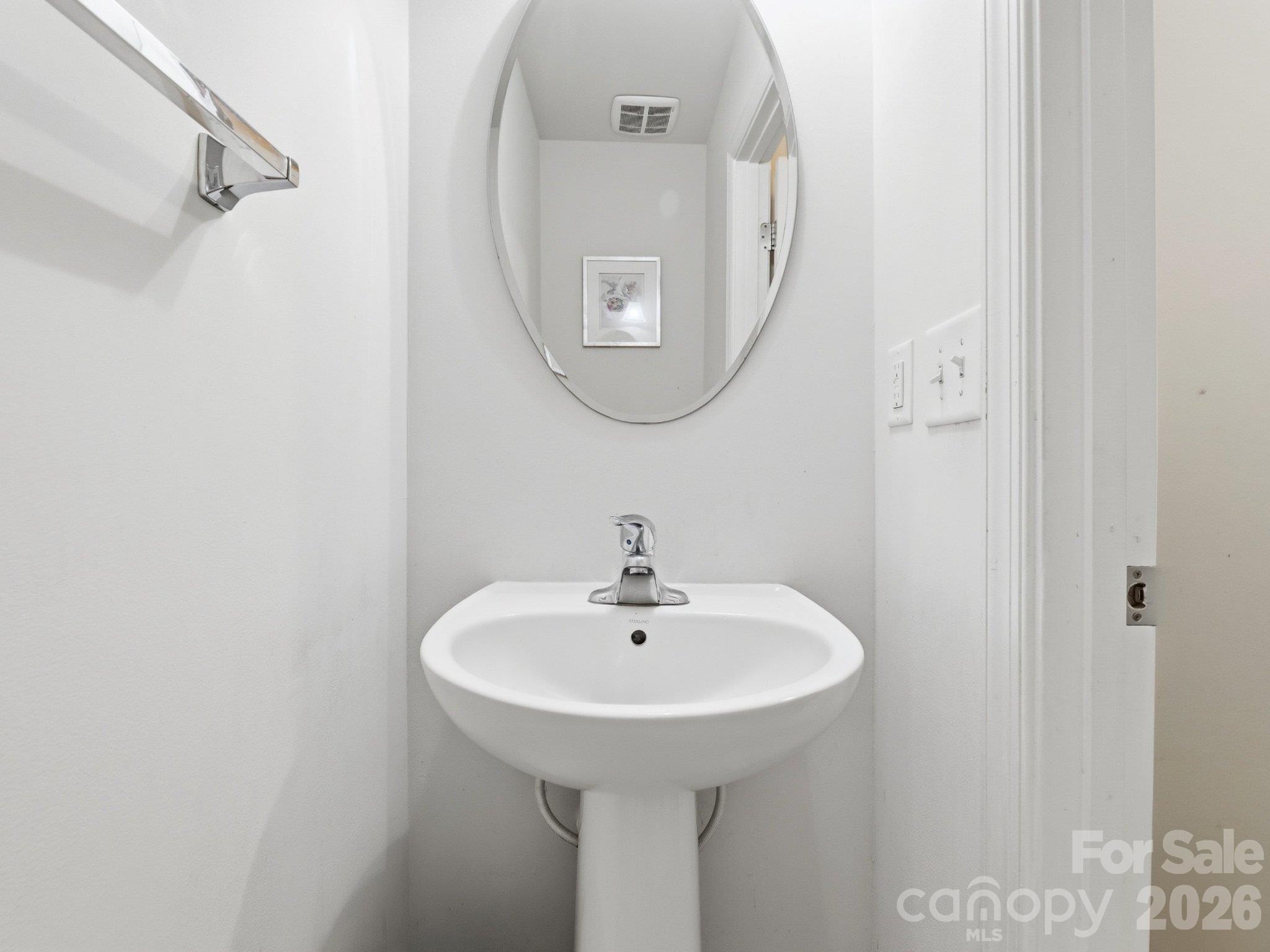Main-level powder room: Half bath conveniently located for everyday use and visiting guests. - 3341 Linetender Drive, Davidson
