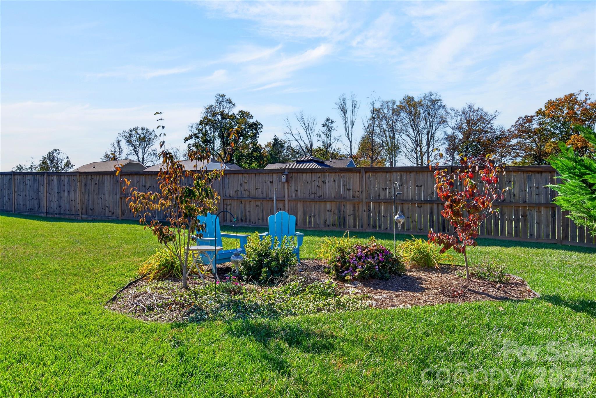 Existing fencing along the rear and sides of the yard makes it easy to complete the enclosure for added privacy and enjoyment. - 313 Tavernier Lane, Candler