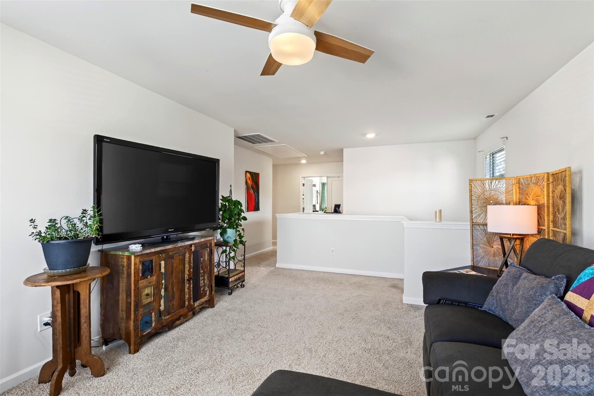 The upstairs loft offers flexible space for a TV room, playroom, or home office to suit your needs.The upstairs loft offers flexible space for a TV room, playroom, or home office to suit your needs.The upstairs loft offers flexible space for a TV room, playroom, or home office to suit your needs. - 313 Tavernier Lane, Candler