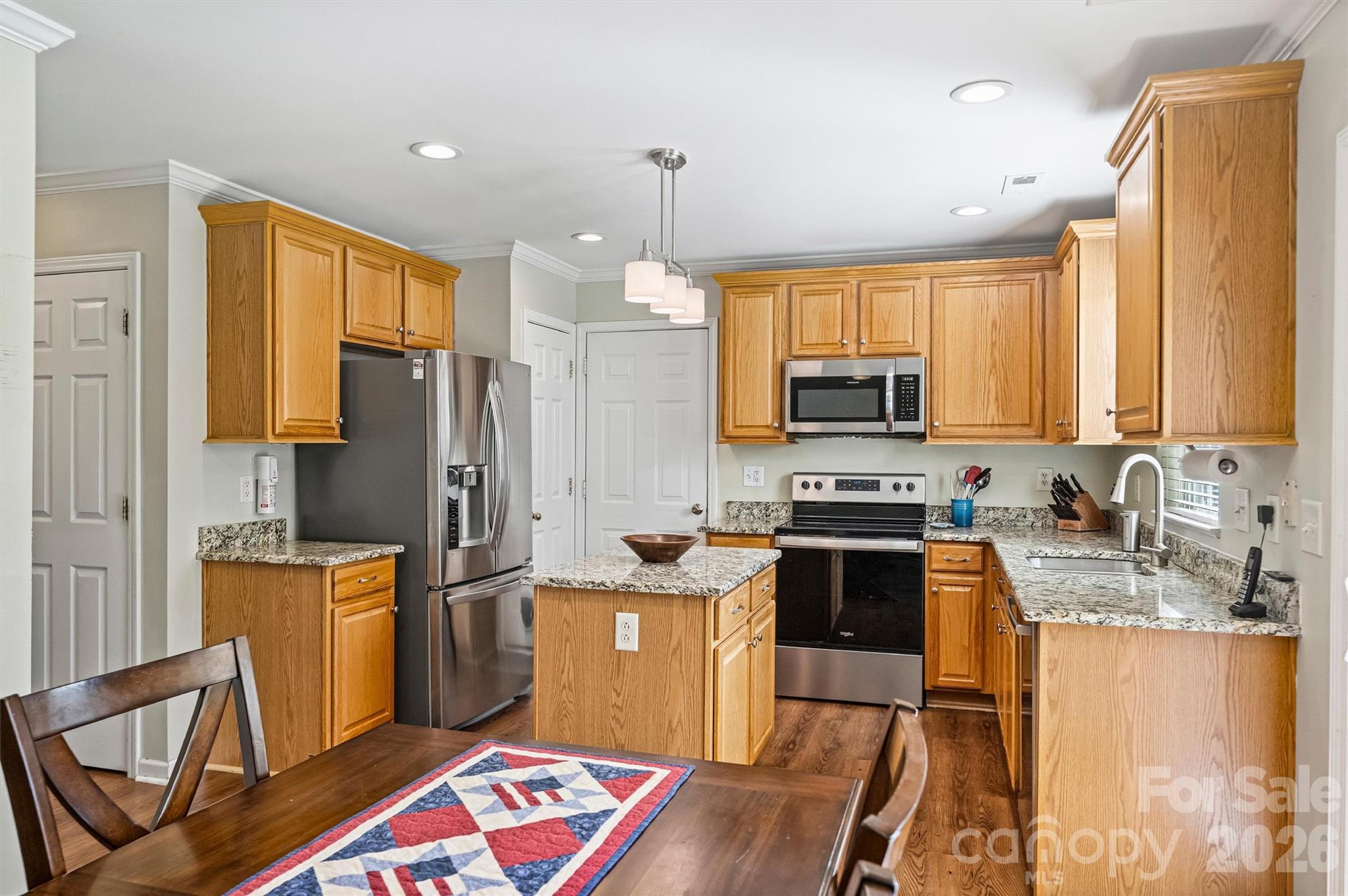Kitchen offers pantry and granite countertops. - 1006 Banaba Court, Indian Trail