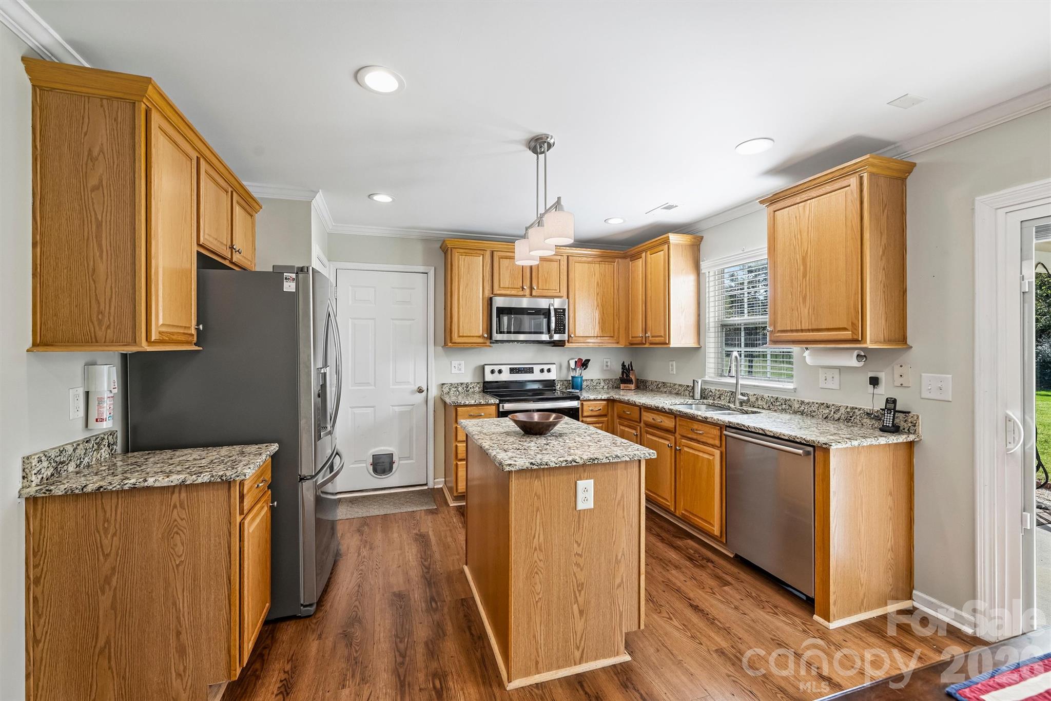 GE French door refrigerator remains. Stainless steel appliances including Bosch dishwasher. - 1006 Banaba Court, Indian Trail