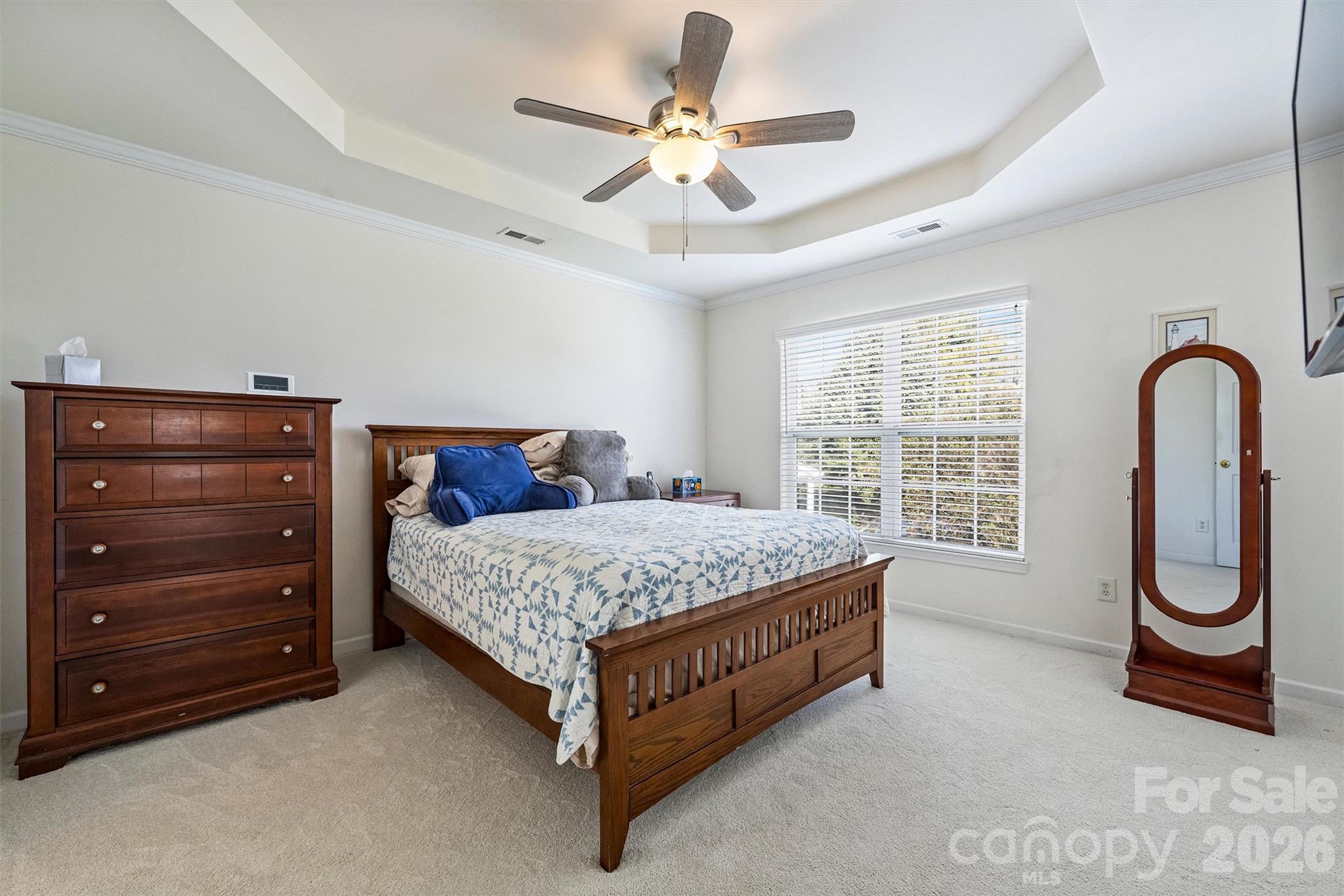 Generously sized primary bedroom with tray ceiling. - 1006 Banaba Court, Indian Trail