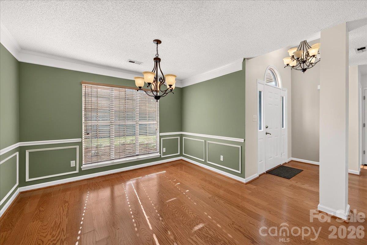 Large dining rom with floor to ceiling windows great lighting throughout the entire home - 9115 Pine Springs Court, Huntersville
