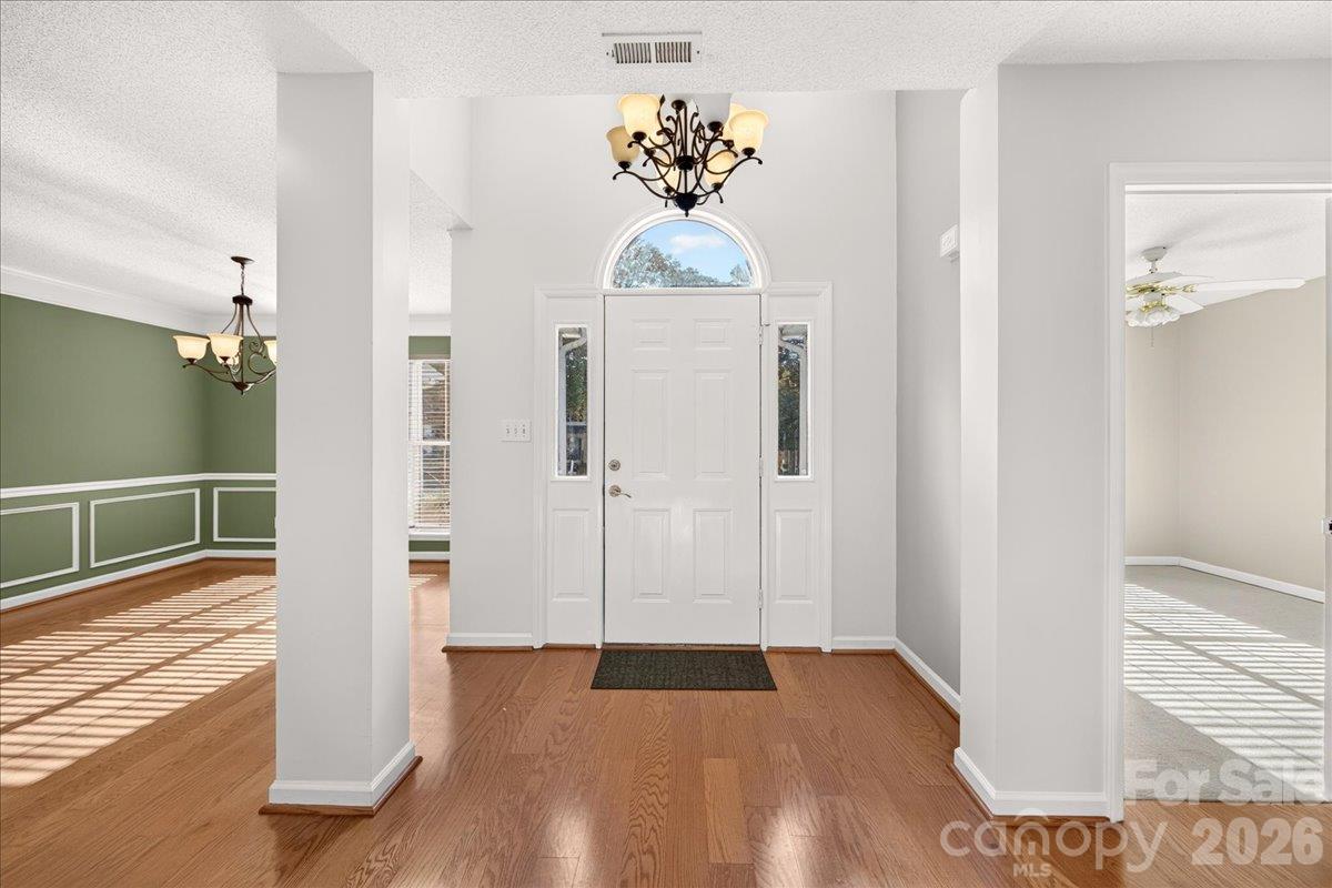 Interior photo of entry with column that create an open foyer - 9115 Pine Springs Court, Huntersville