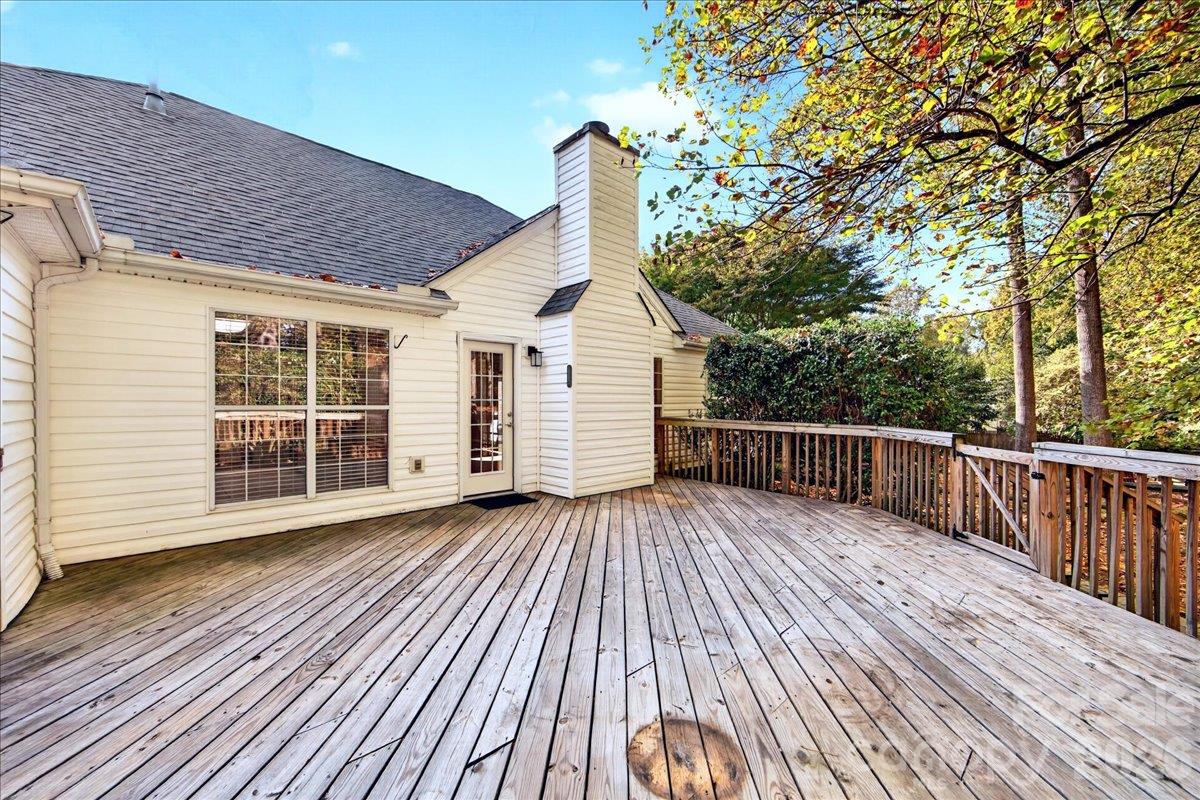 wooden deck built in 2021 with french door from living space - 9115 Pine Springs Court, Huntersville