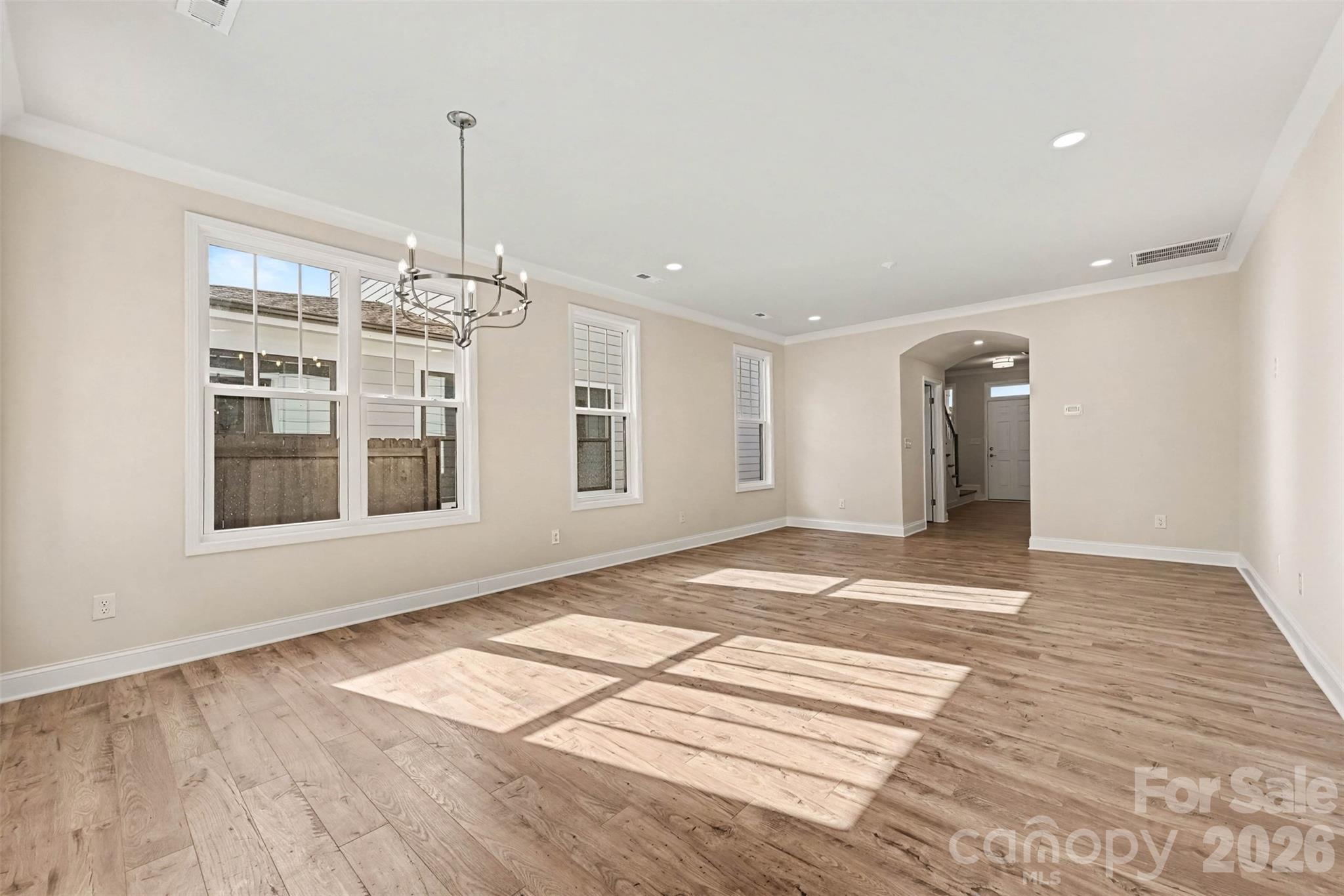 Arched opening from Foyer to Living. Crown molding in main living areas. - 10225 Rainier Trail Drive NW, Huntersville