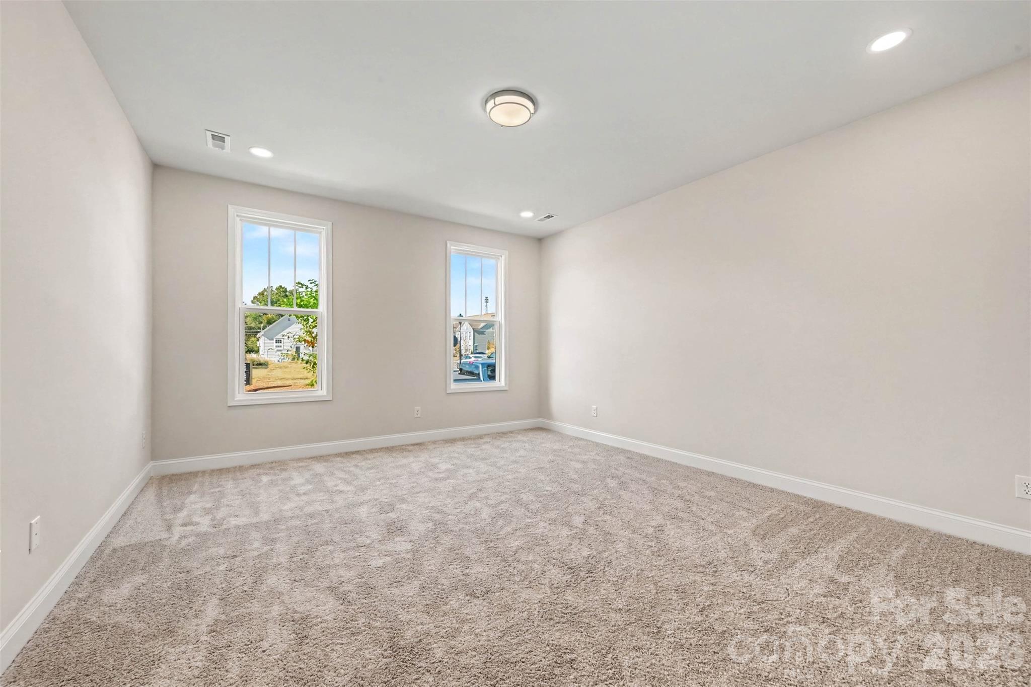 First Floor Primary Bedroom - 10225 Rainier Trail Drive NW, Huntersville