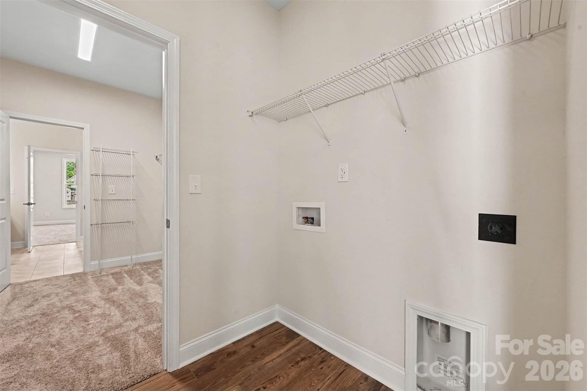 Laundry Room connect to Primary closet - 10225 Rainier Trail Drive NW, Huntersville